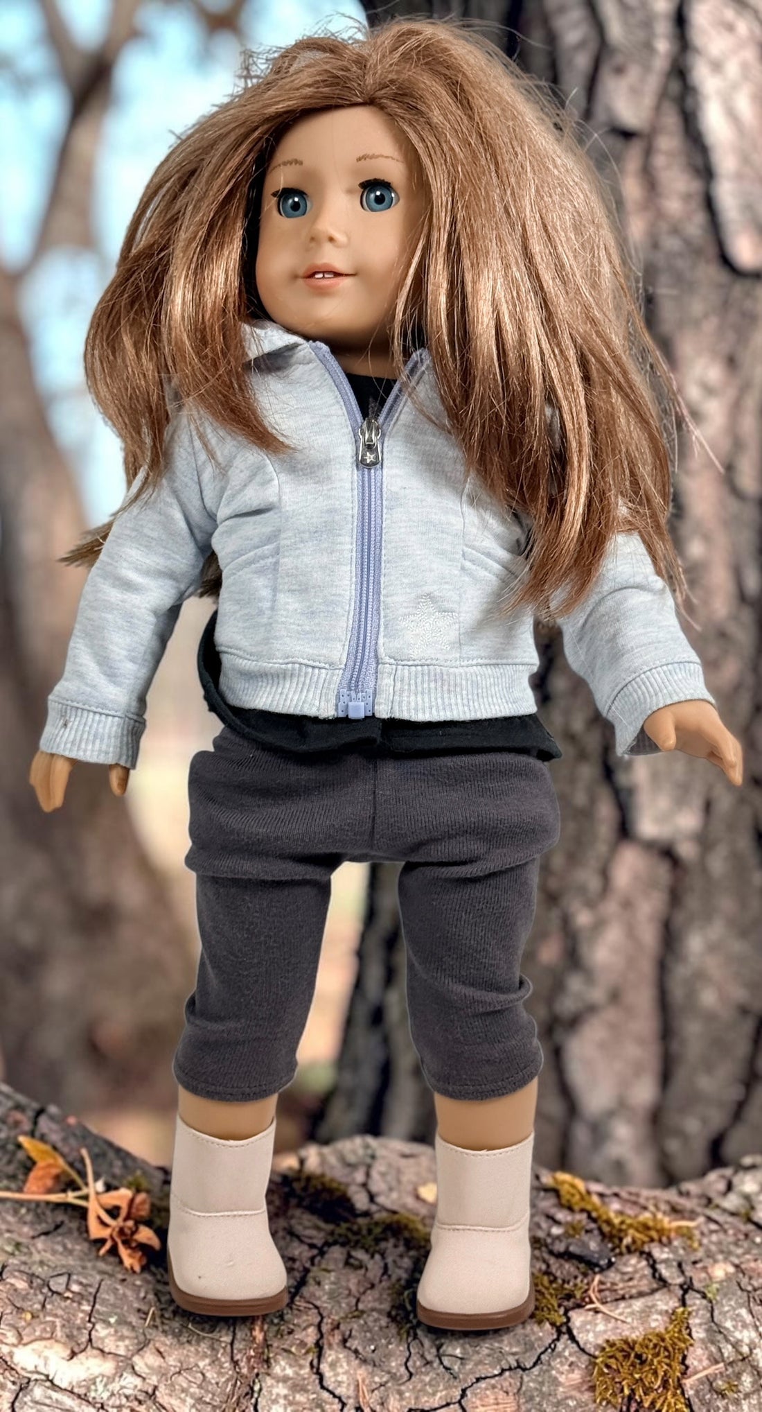 Authentic American Girl 18-inch Truly Me doll with blue eyes, light brown hair, gray hoodie outfit and pink boots. Good pre-owned condition, complete outfit included.