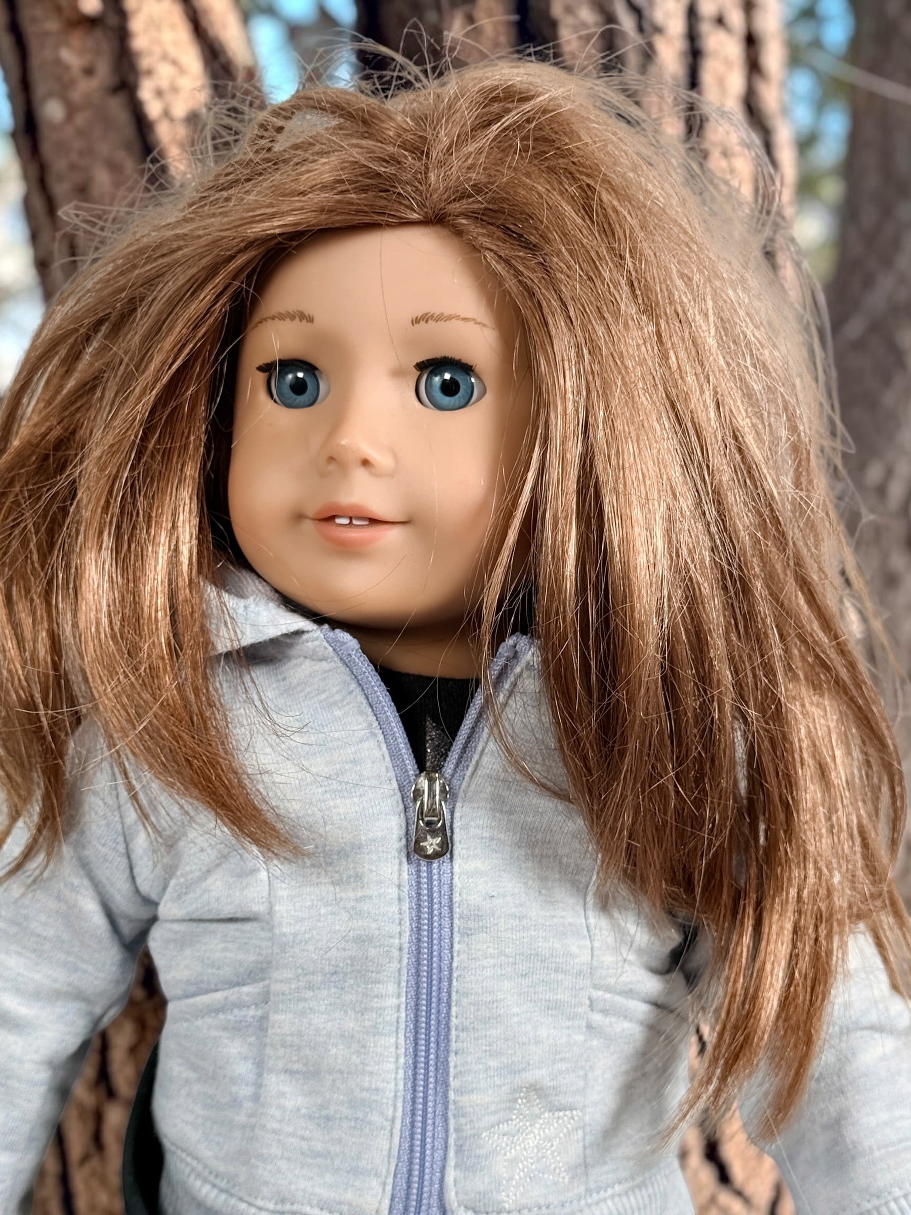 Authentic American Girl 18-inch Truly Me doll with blue eyes, light brown hair, gray hoodie outfit and pink boots. Good pre-owned condition, complete outfit included.