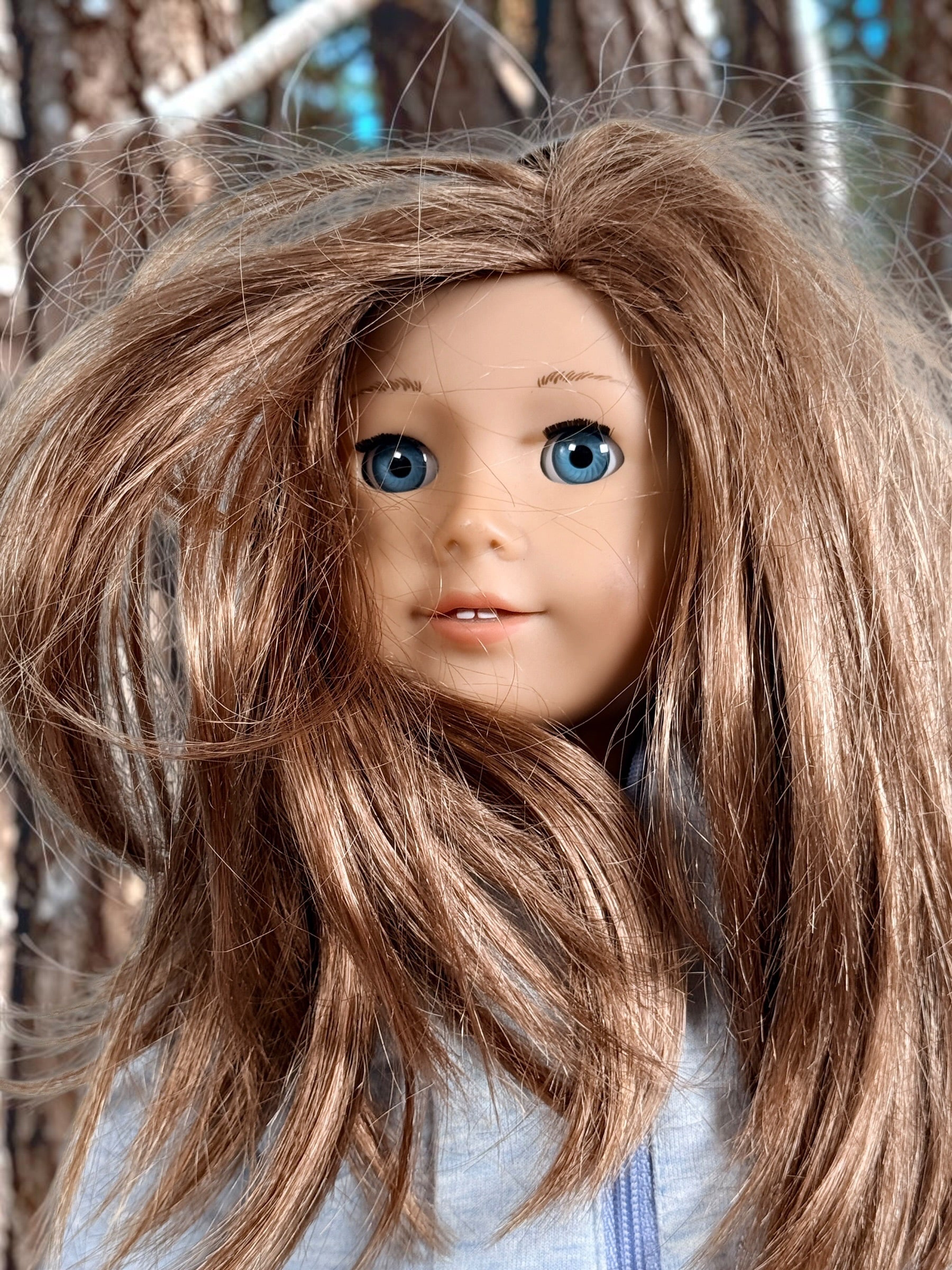 Authentic American Girl 18-inch Truly Me doll with blue eyes, light brown hair, gray hoodie outfit and pink boots. Good pre-owned condition, complete outfit included.