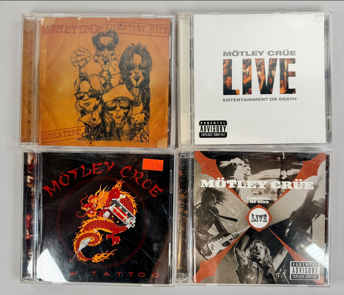 Original Mötley Crüe CD collection including Greatest Hits, Live: Entertainment or Death, Carnival of Sins Live, and New Tattoo with original cases.