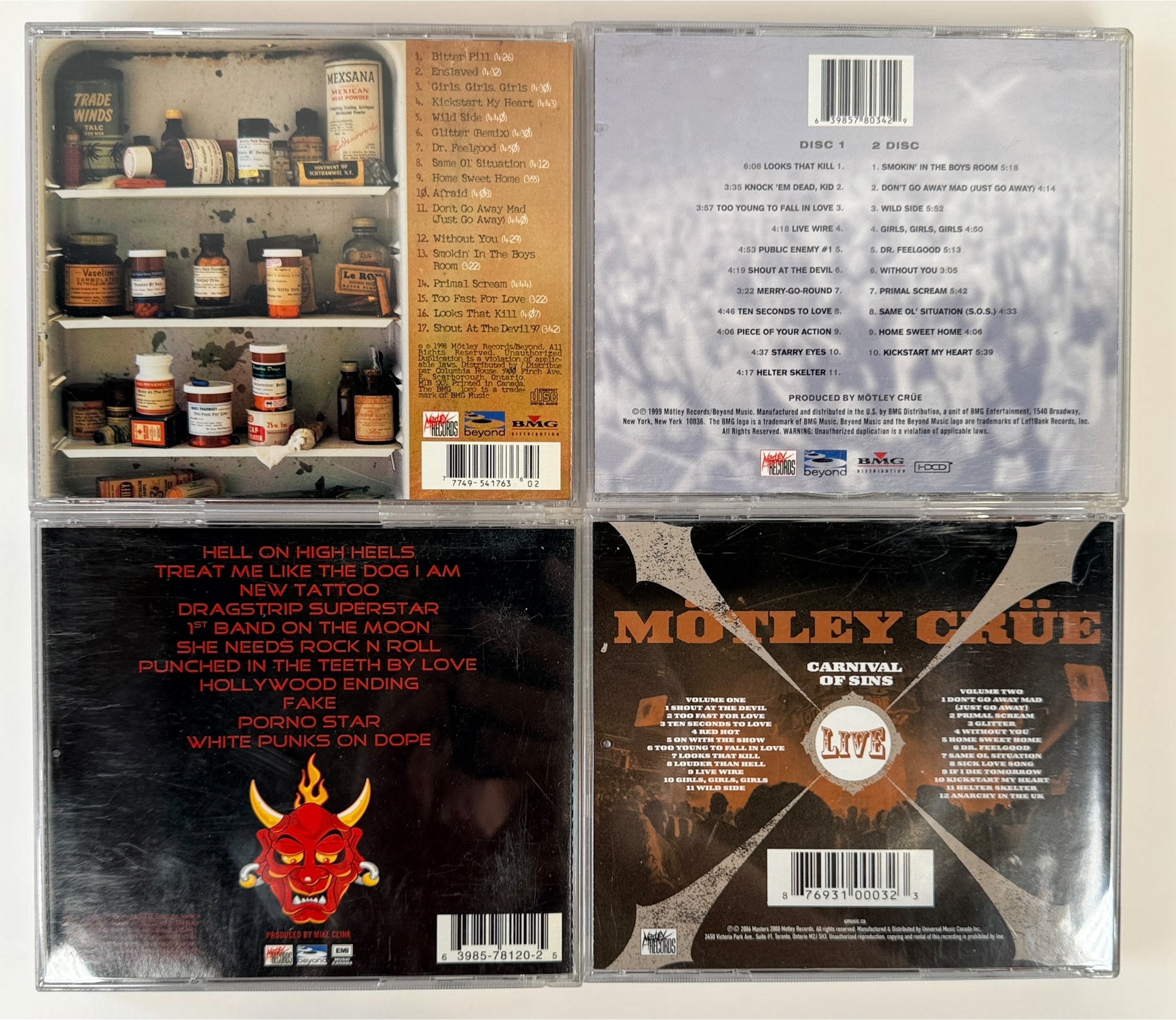 Original Mötley Crüe CD collection including Greatest Hits, Live: Entertainment or Death, Carnival of Sins Live, and New Tattoo with original cases.