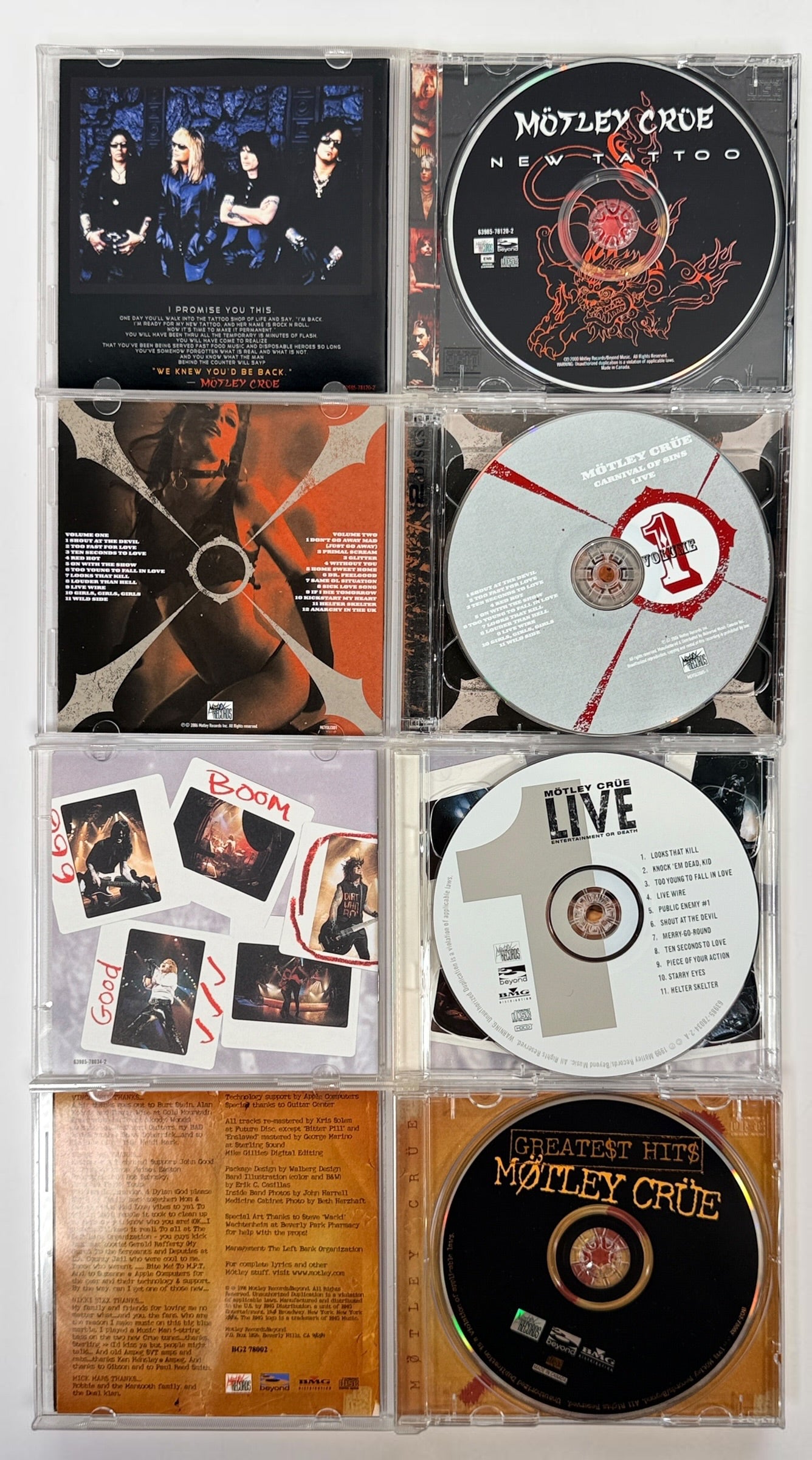 Original Mötley Crüe CD collection including Greatest Hits, Live: Entertainment or Death, Carnival of Sins Live, and New Tattoo with original cases.