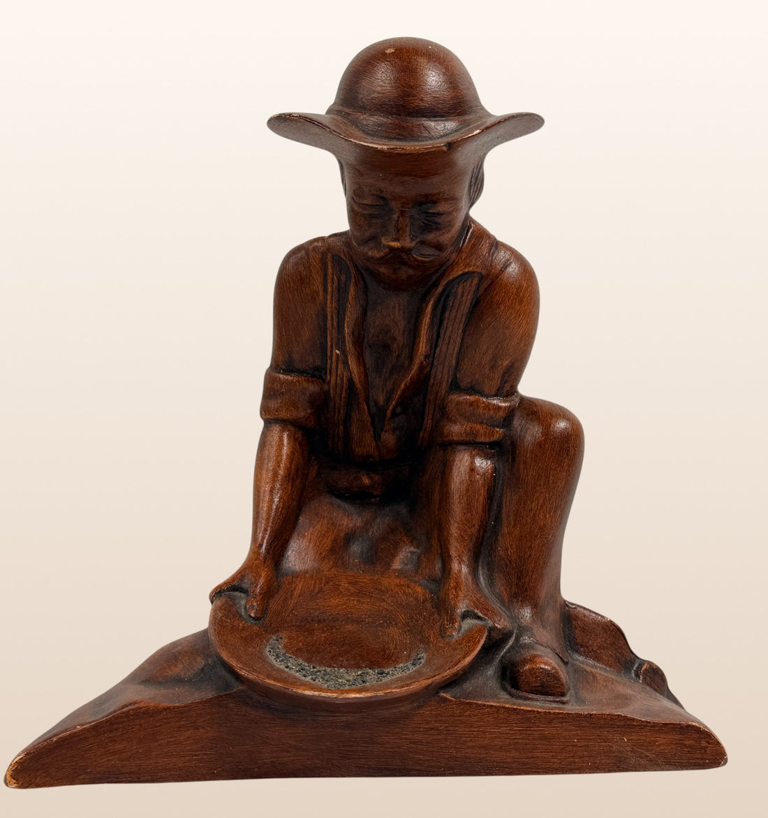 Vintage ceramic Gold Rush prospector ashtray with faux wood finish. Mid-century Western décor collectible, ideal for rustic cabins, Americana, and tobacco memorabilia collectors.