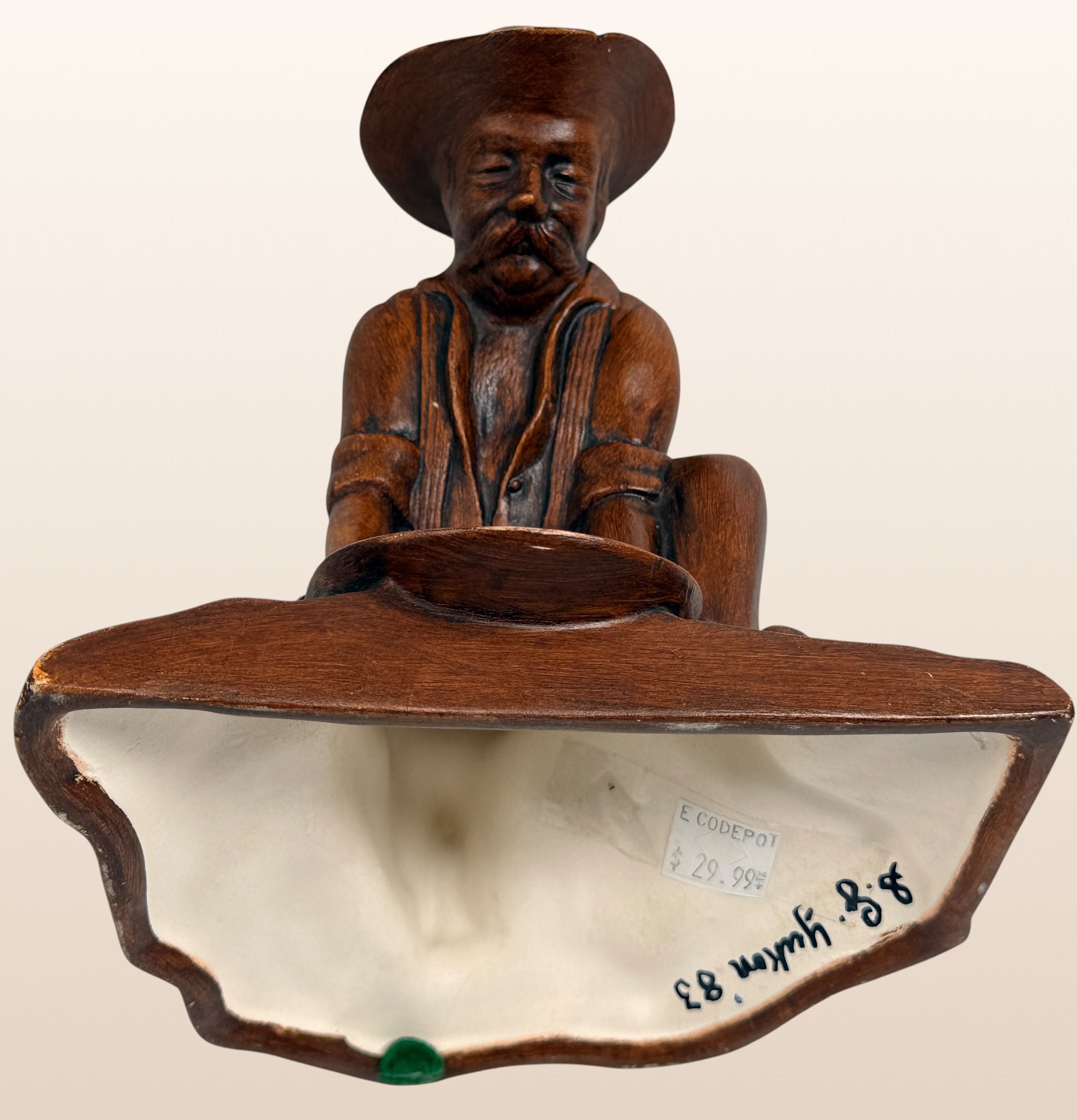 Vintage ceramic Gold Rush prospector ashtray with faux wood finish. Mid-century Western décor collectible, ideal for rustic cabins, Americana, and tobacco memorabilia collectors.