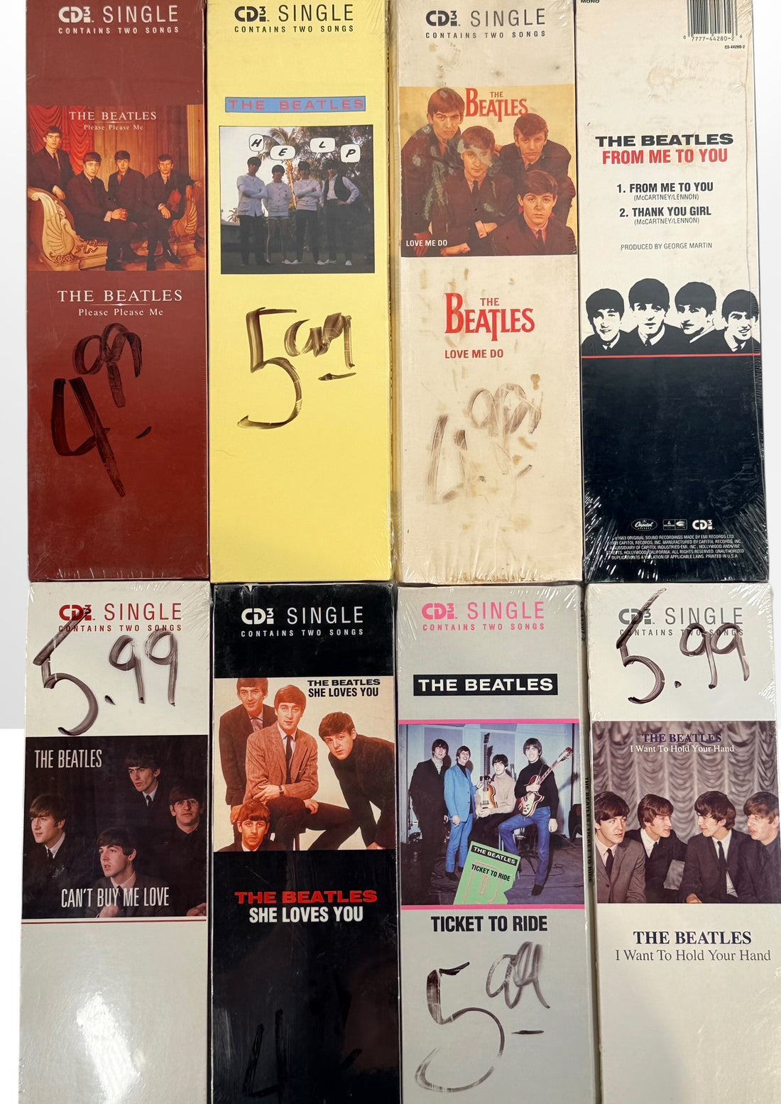 Complete set of eight factory sealed Beatles CD3 Singles in original Capitol longboxes. Rare late-1980s collectible featuring classic hit singles and original packaging.