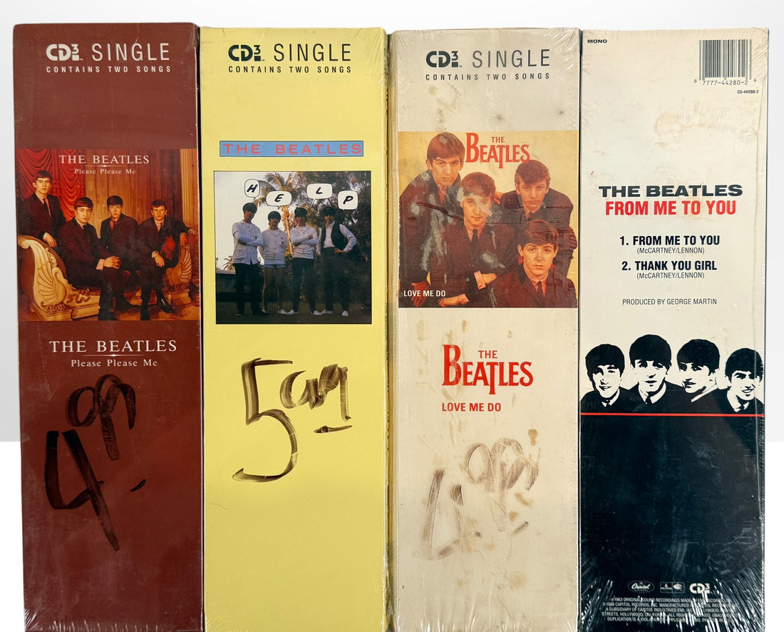 Complete set of eight factory sealed Beatles CD3 Singles in original Capitol longboxes. Rare late-1980s collectible featuring classic hit singles and original packaging.