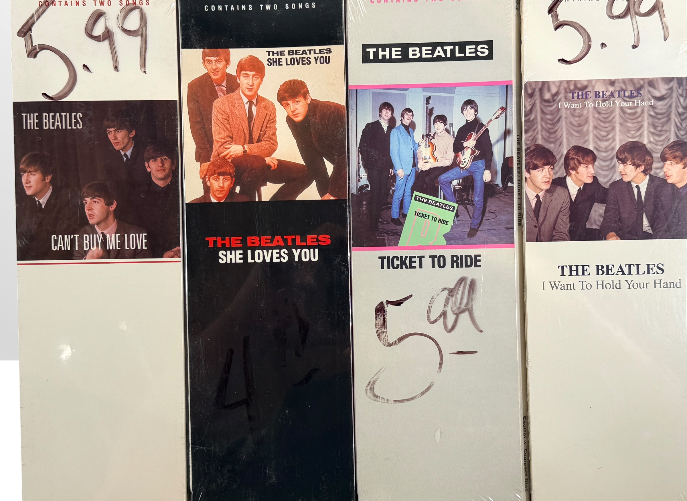 Complete set of eight factory sealed Beatles CD3 Singles in original Capitol longboxes. Rare late-1980s collectible featuring classic hit singles and original packaging.