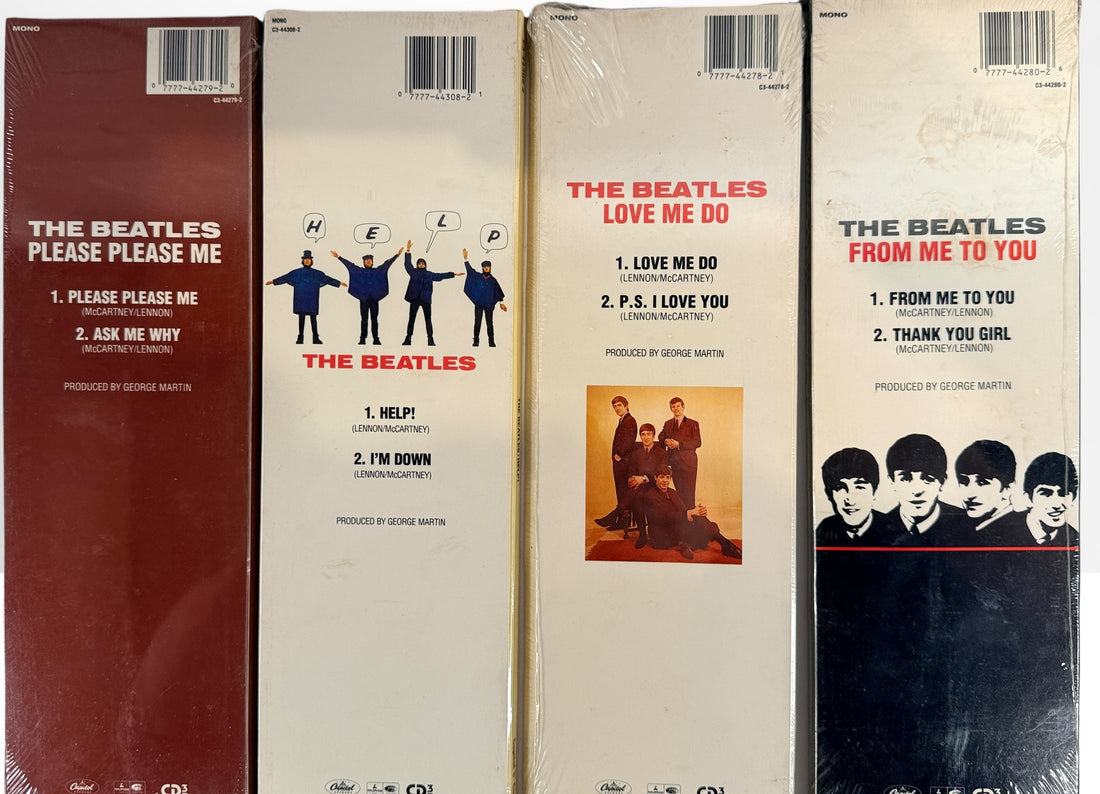 Complete set of eight factory sealed Beatles CD3 Singles in original Capitol longboxes. Rare late-1980s collectible featuring classic hit singles and original packaging.