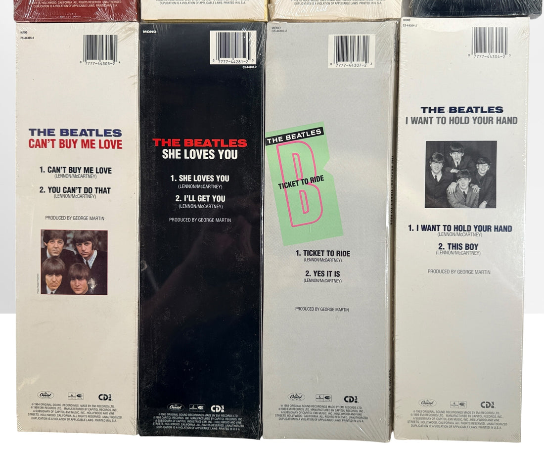 Complete set of eight factory sealed Beatles CD3 Singles in original Capitol longboxes. Rare late-1980s collectible featuring classic hit singles and original packaging.