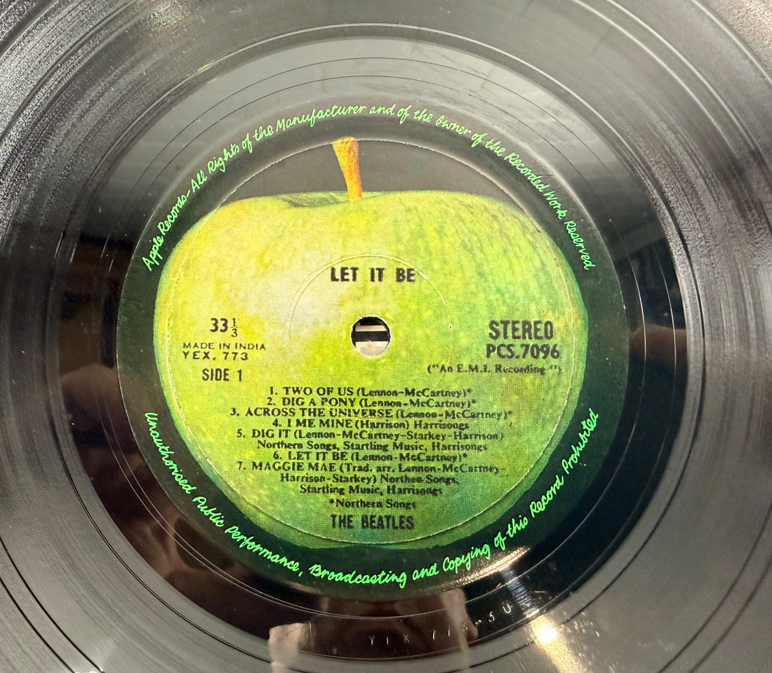 Rare Indian pressing of The Beatles Let It Be on Apple Records PCS 7096. Original EMI India vinyl LP with Apple labels, collectible Beatles album in VG+ condition.