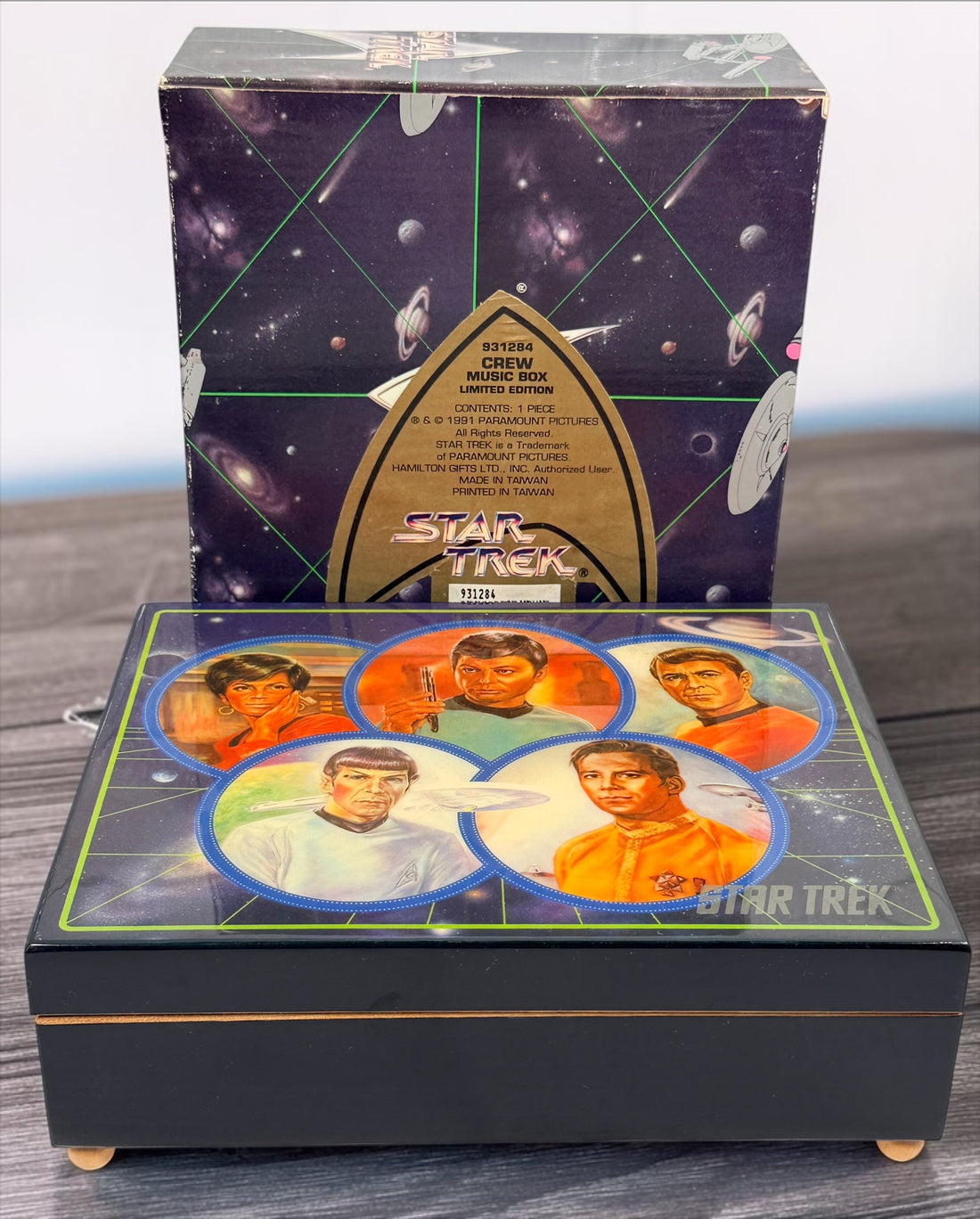 Official 1991 Star Trek Crew Music Box by Hamilton Gifts. Limited edition wind-up collectible featuring Kirk, Spock, McCoy, Scotty, and Uhura with original box.