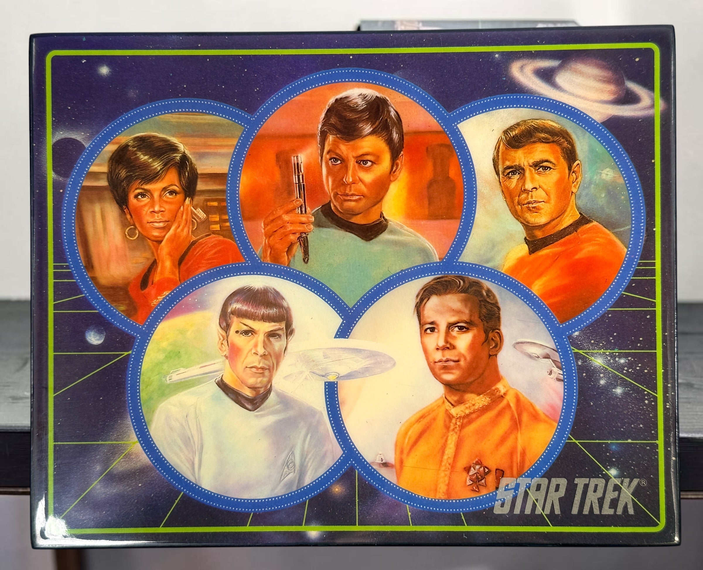 Official 1991 Star Trek Crew Music Box by Hamilton Gifts. Limited edition wind-up collectible featuring Kirk, Spock, McCoy, Scotty, and Uhura with original box.