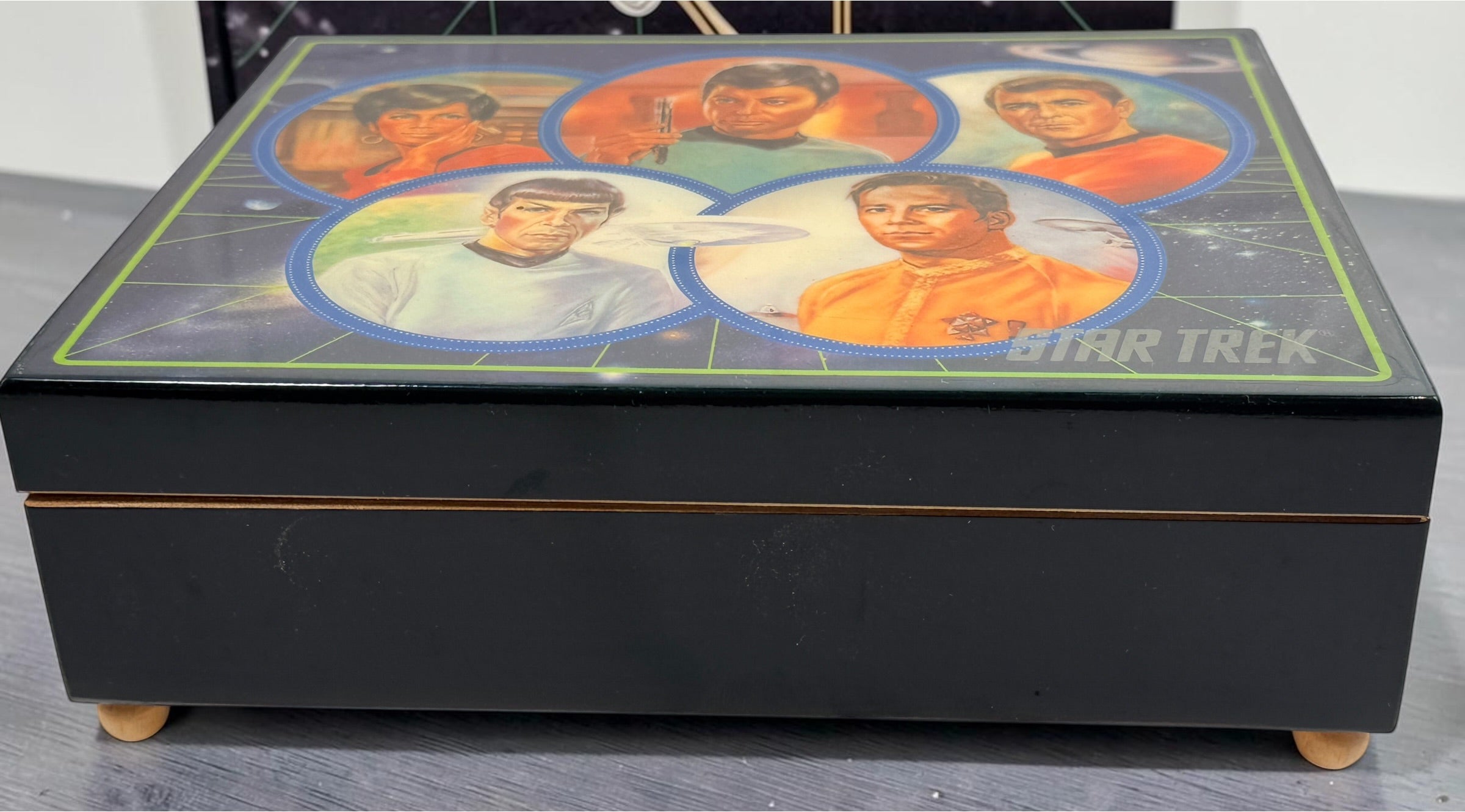 Official 1991 Star Trek Crew Music Box by Hamilton Gifts. Limited edition wind-up collectible featuring Kirk, Spock, McCoy, Scotty, and Uhura with original box.