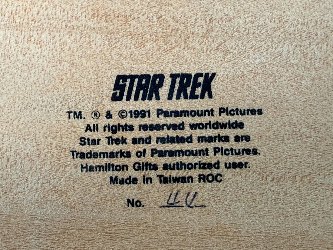 Official 1991 Star Trek Crew Music Box by Hamilton Gifts. Limited edition wind-up collectible featuring Kirk, Spock, McCoy, Scotty, and Uhura with original box.