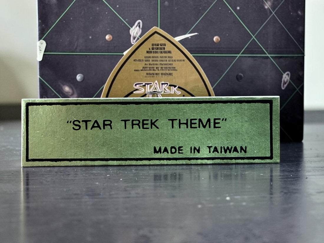 Official 1991 Star Trek Crew Music Box by Hamilton Gifts. Limited edition wind-up collectible featuring Kirk, Spock, McCoy, Scotty, and Uhura with original box.