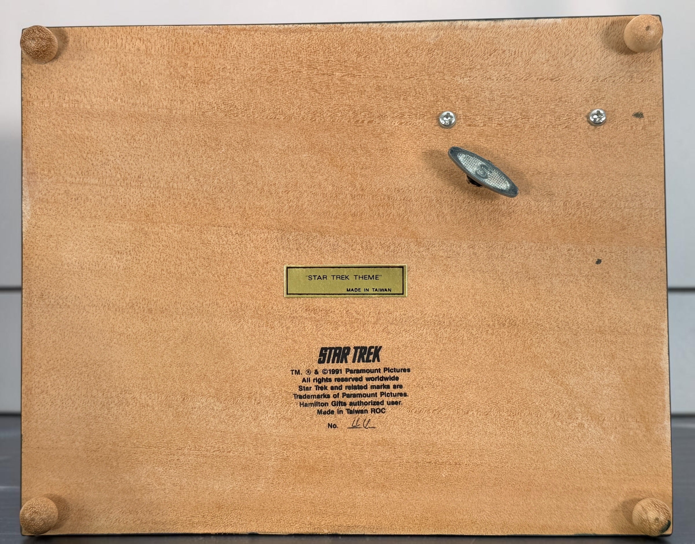 Official 1991 Star Trek Crew Music Box by Hamilton Gifts. Limited edition wind-up collectible featuring Kirk, Spock, McCoy, Scotty, and Uhura with original box.