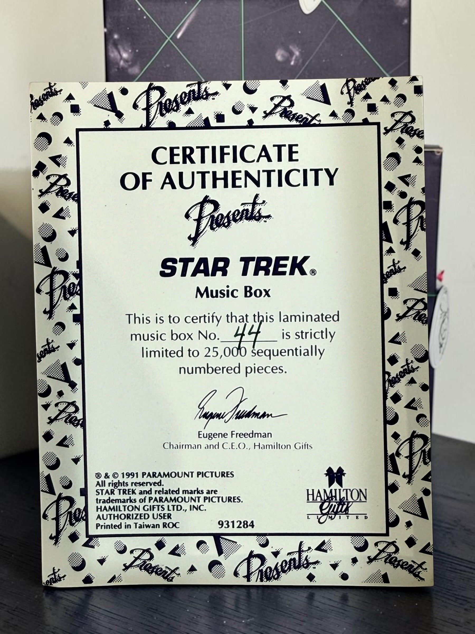 Official 1991 Star Trek Crew Music Box by Hamilton Gifts. Limited edition wind-up collectible featuring Kirk, Spock, McCoy, Scotty, and Uhura with original box.