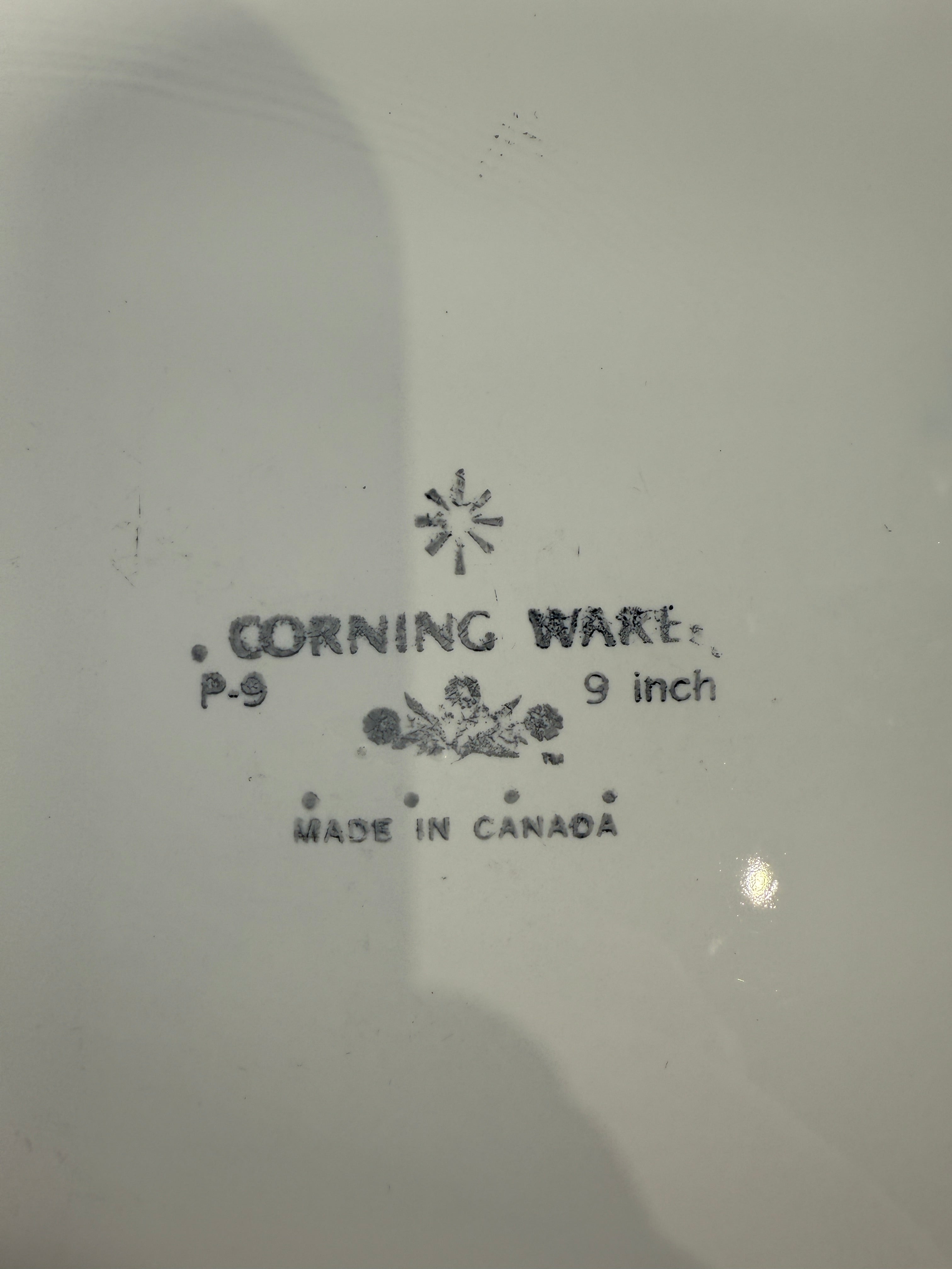 Corning Ware dish with branding and size information on a white background