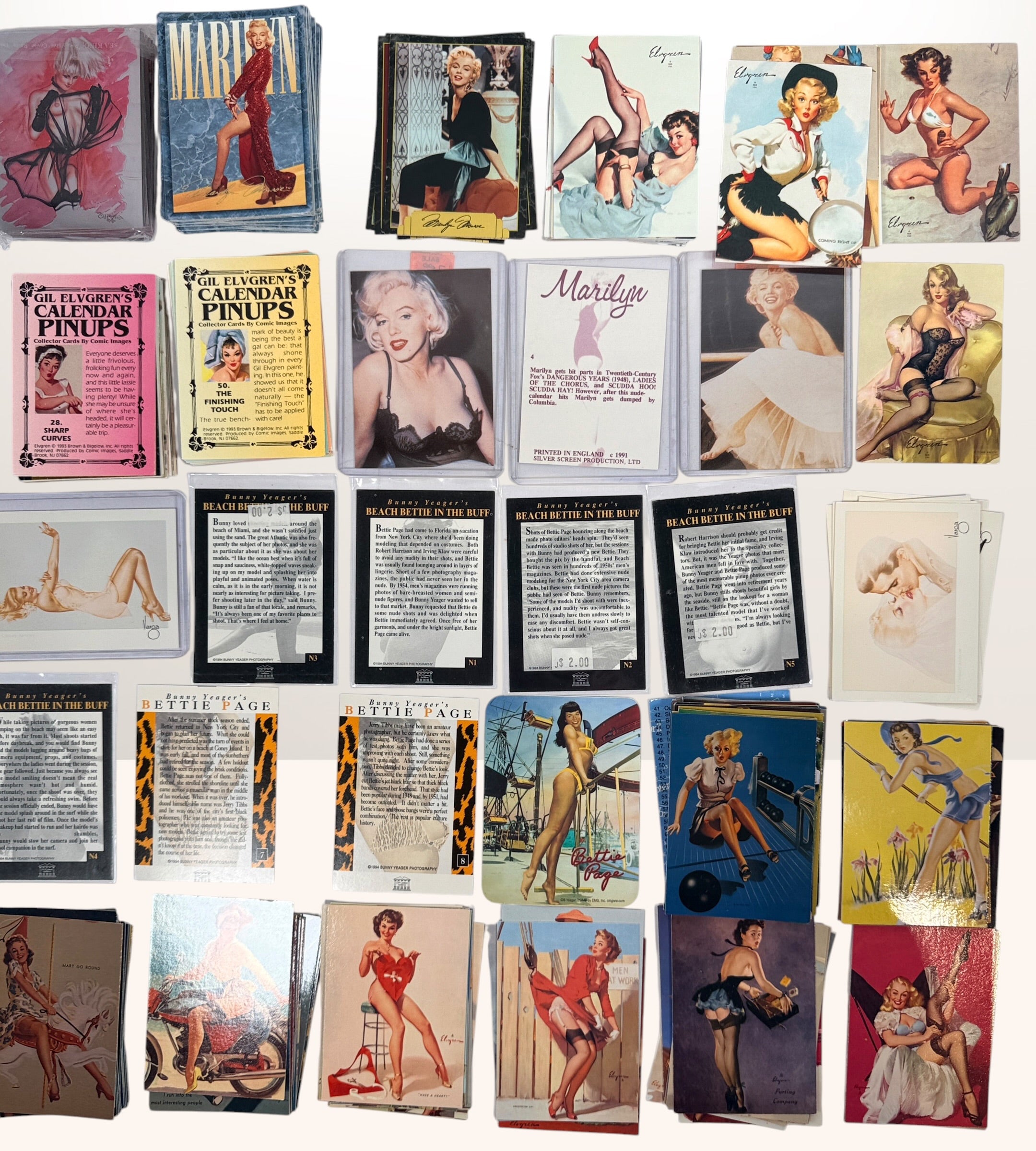 Large lot of 285+ vintage pin-up trading cards featuring Gil Elvgren, Bettie Page, Bunny Yeager, Marilyn Monroe and Comic Images collectible card sets.