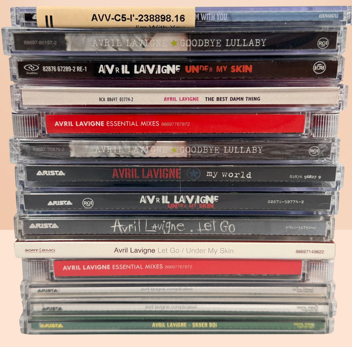 Avril Lavigne CD collection featuring 14 releases including two factory-sealed albums, DualDisc, Essential Mixes, collectible singles, and classic studio albums.