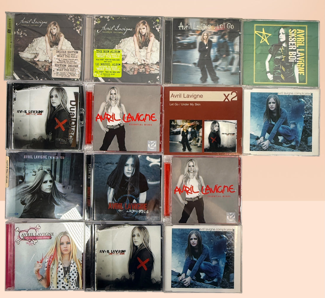 Avril Lavigne CD collection featuring 14 releases including two factory-sealed albums, DualDisc, Essential Mixes, collectible singles, and classic studio albums.