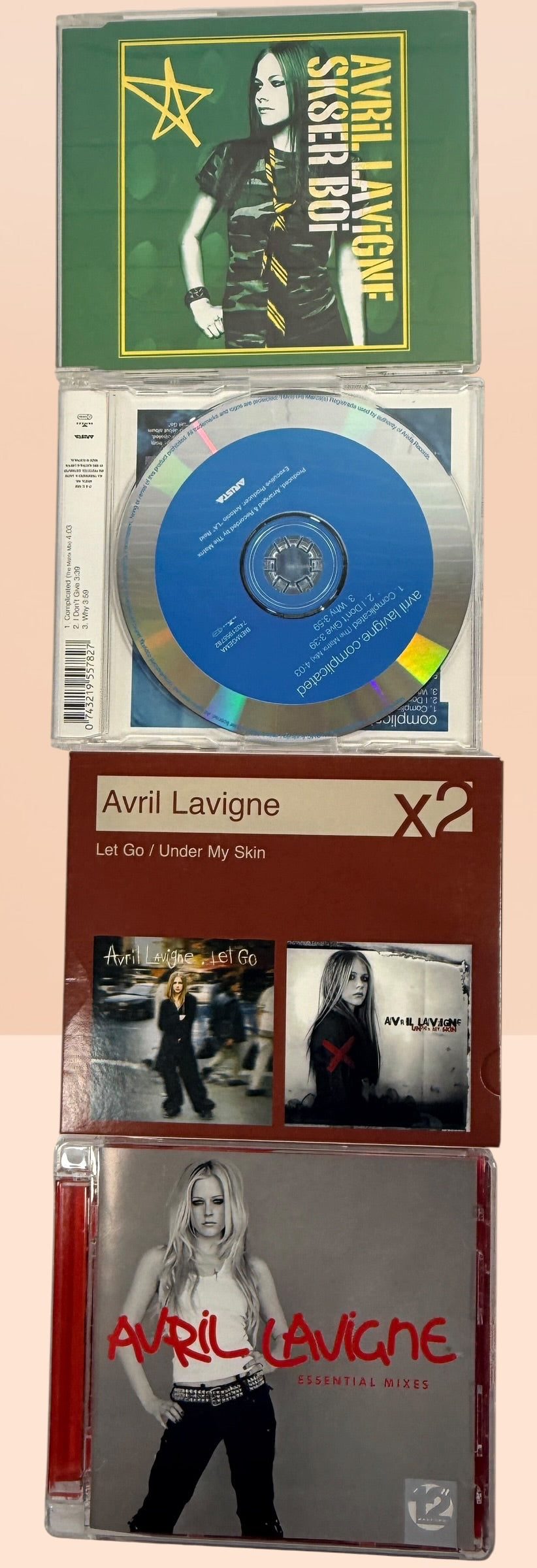 Avril Lavigne CD collection featuring 14 releases including two factory-sealed albums, DualDisc, Essential Mixes, collectible singles, and classic studio albums.