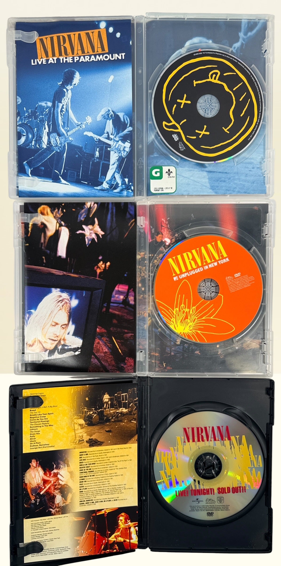 Official Nirvana DVD collection featuring MTV Unplugged, Live at the Paramount, Live! Tonight! Sold Out!!, and factory-sealed Live at Reading.