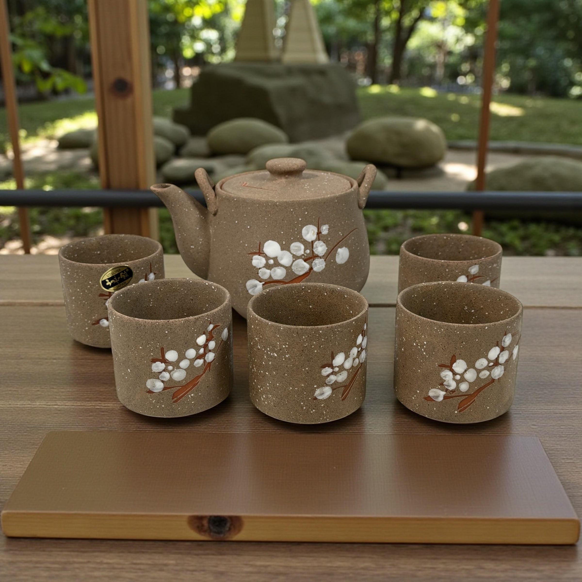UTSUWA Japan stoneware tea set with plum blossom design, boxed with teapot and six cups. Excellent condition. Great Japanese ceramic gift set.