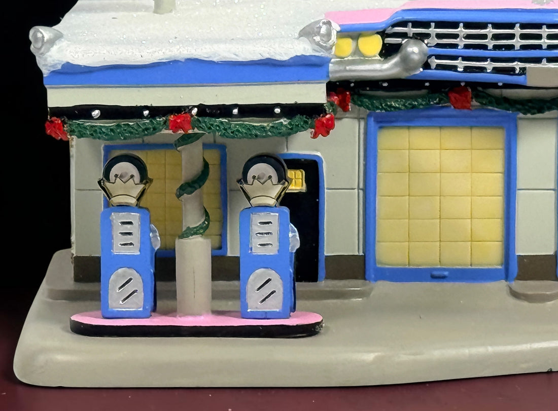 Retired 2009 Hawthorne Village Elvis Presley Patch It Up Service Station from the Rock ‘n’ Roll Holiday Village collection. Light cord not included.