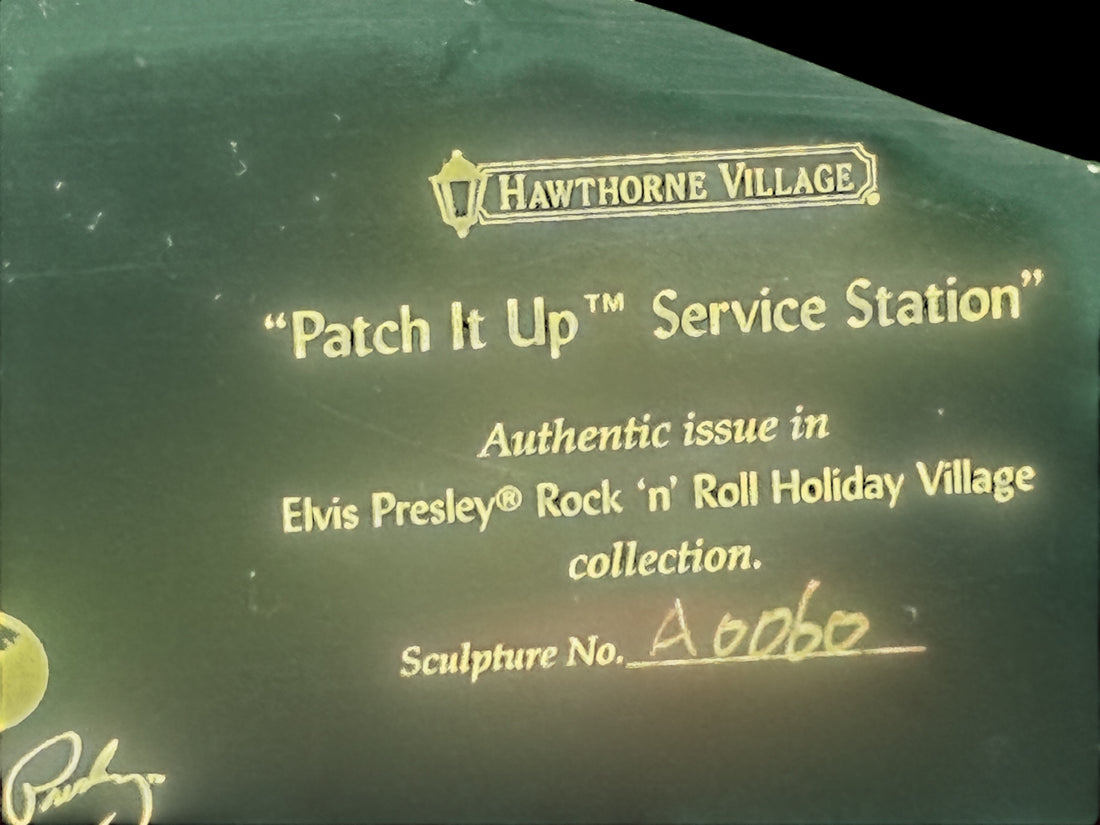 Retired 2009 Hawthorne Village Elvis Presley Patch It Up Service Station from the Rock ‘n’ Roll Holiday Village collection. Light cord not included.