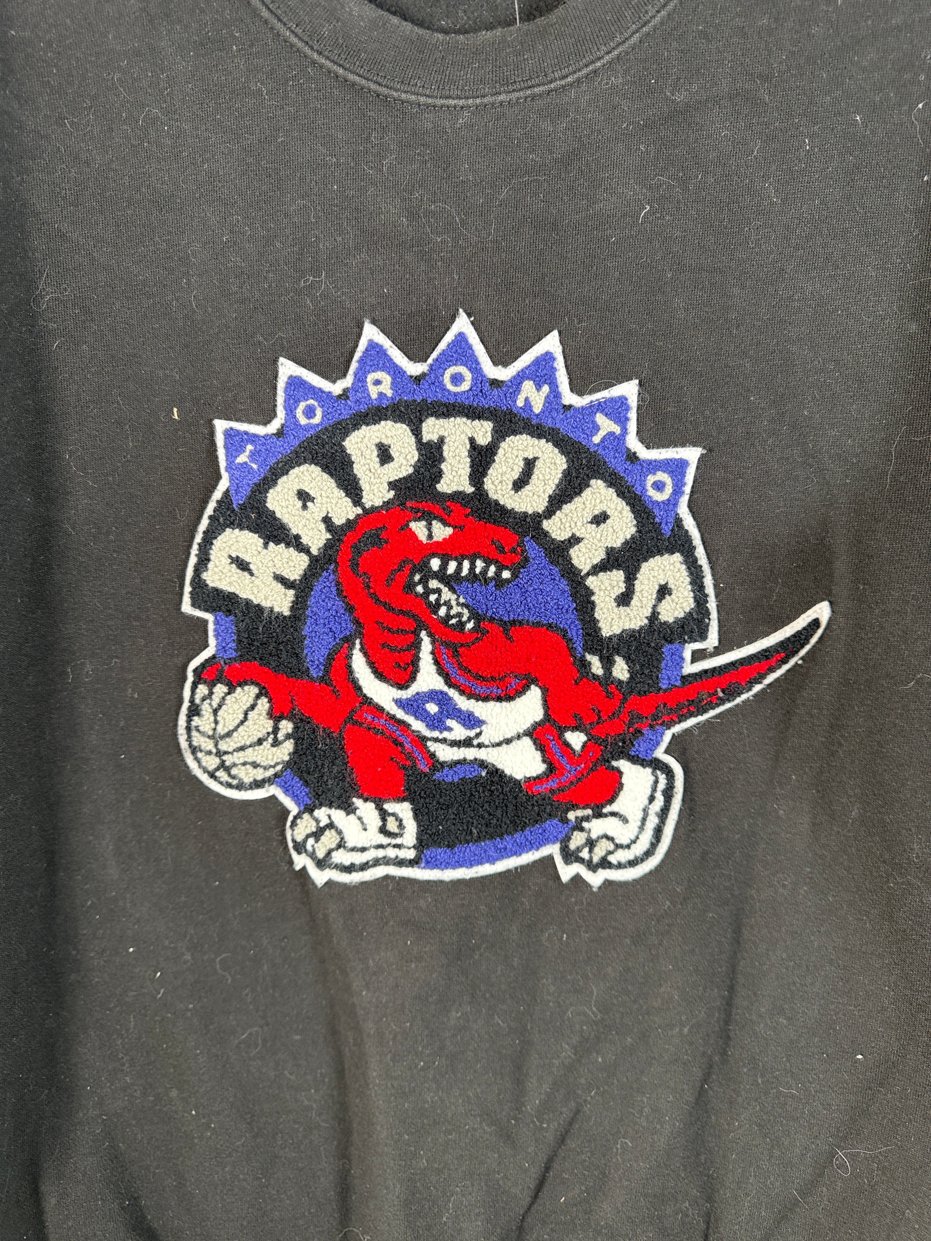 Vintage-style Toronto Raptors crewneck by Mitchell &amp; Ness with classic dinosaur logo. Clean, bold graphic. Great condition. Ships fast from Montreal.