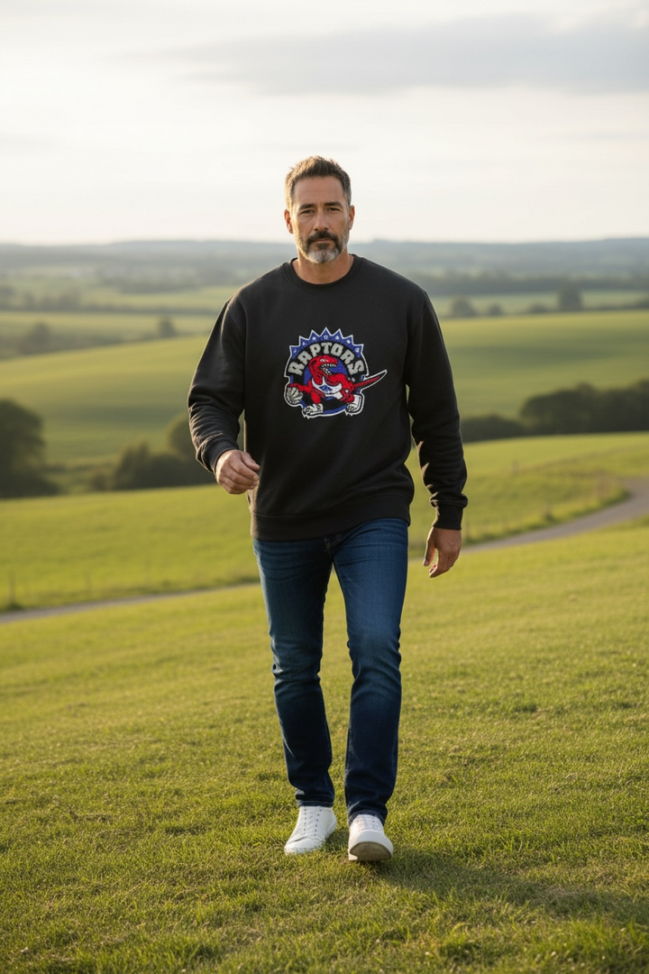 Vintage-style Toronto Raptors crewneck by Mitchell &amp; Ness with classic dinosaur logo. Clean, bold graphic. Great condition. Ships fast from Montreal.