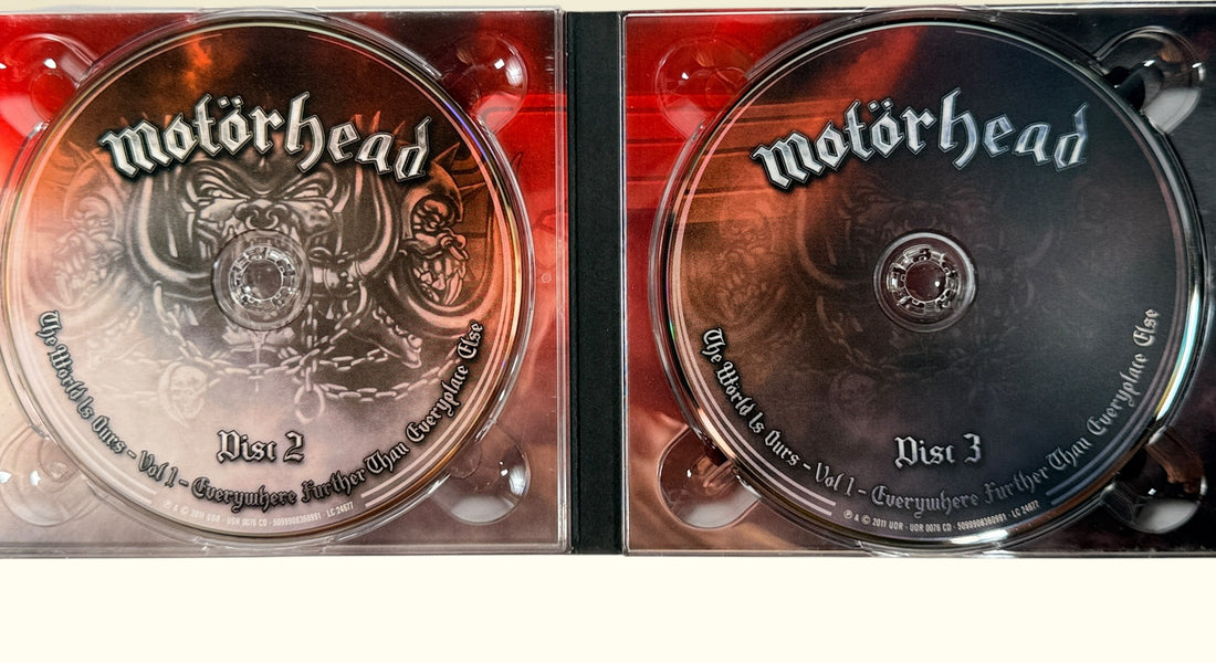 Complete Motörhead The World Is Ours Vol. 1 deluxe 3-disc live set with DVD and 2 audio CDs. Features Lemmy, Ace of Spades, Overkill, and bonus interviews.