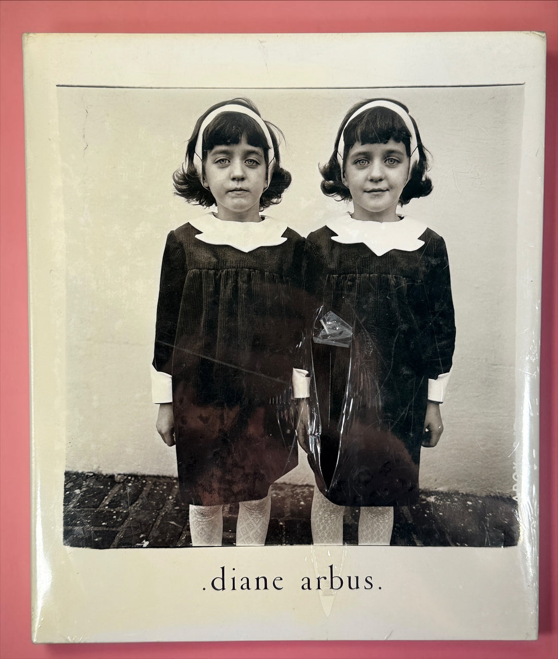 Factory sealed Diane Arbus An Aperture Monograph 25th Anniversary Edition hardcover by Aperture. Classic fine art photography book with original dust jacket and shrink wrap.