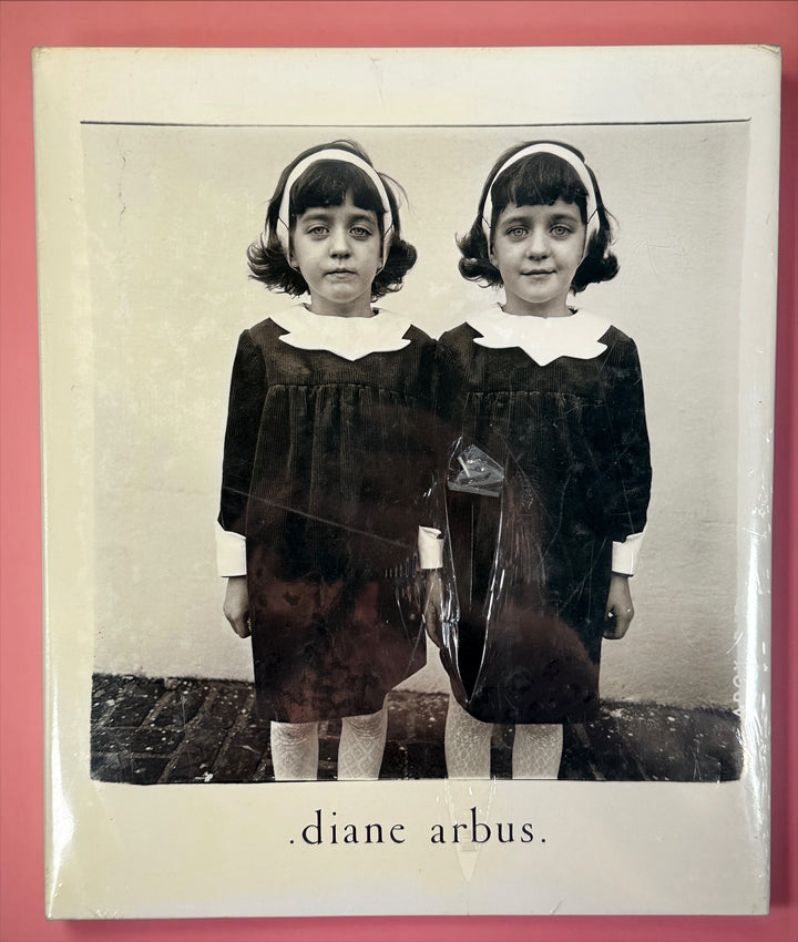 Factory sealed Diane Arbus An Aperture Monograph 25th Anniversary Edition hardcover by Aperture. Classic fine art photography book with original dust jacket and shrink wrap.