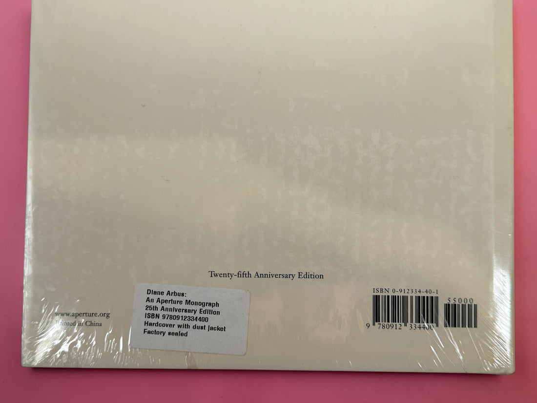 Factory sealed Diane Arbus An Aperture Monograph 25th Anniversary Edition hardcover by Aperture. Classic fine art photography book with original dust jacket and shrink wrap.