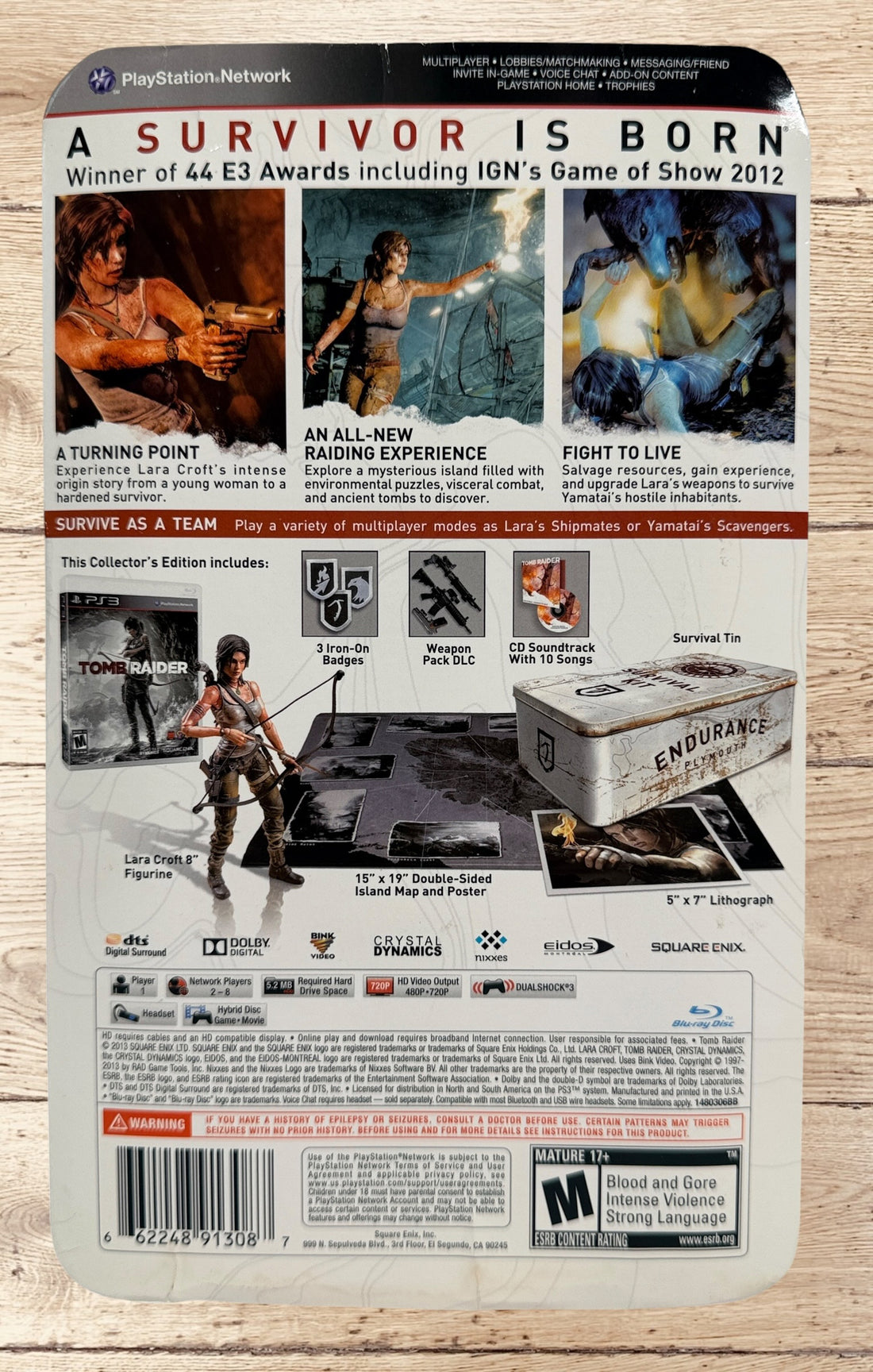 Complete Tomb Raider PS3 Collector’s Edition Survival Kit with Lara Croft figure, soundtrack CD, comic, map, sealed badges, lithograph and original metal collector’s tin.