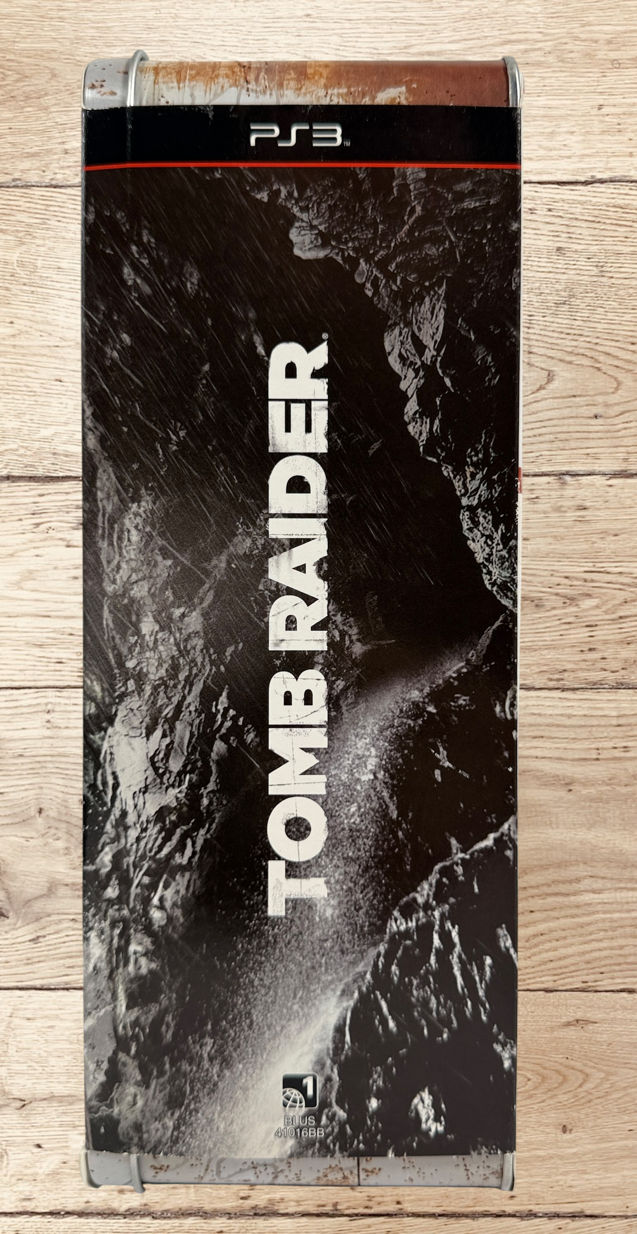 Complete Tomb Raider PS3 Collector’s Edition Survival Kit with Lara Croft figure, soundtrack CD, comic, map, sealed badges, lithograph and original metal collector’s tin.