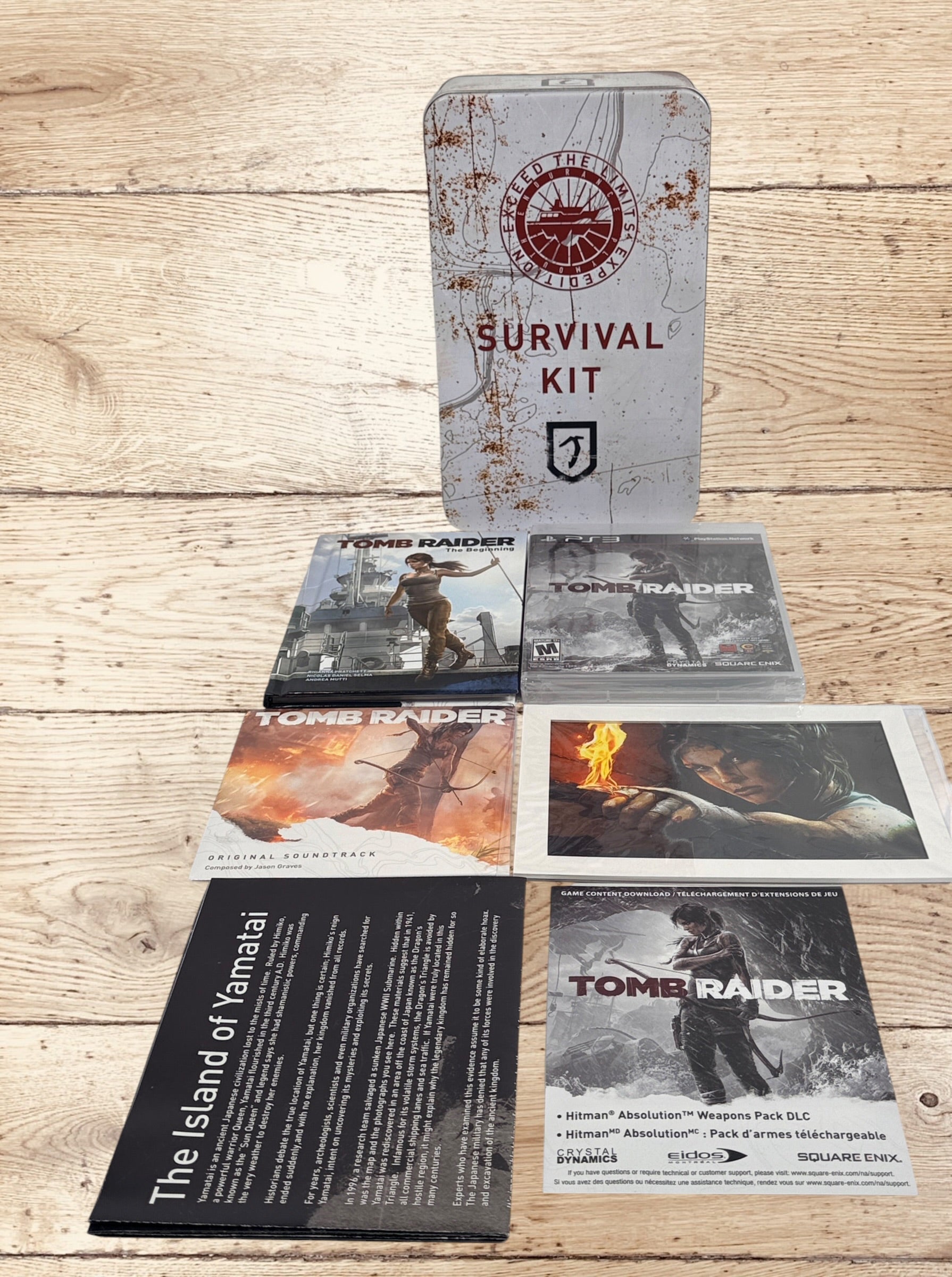 Complete Tomb Raider PS3 Collector’s Edition Survival Kit with Lara Croft figure, soundtrack CD, comic, map, sealed badges, lithograph and original metal collector’s tin.