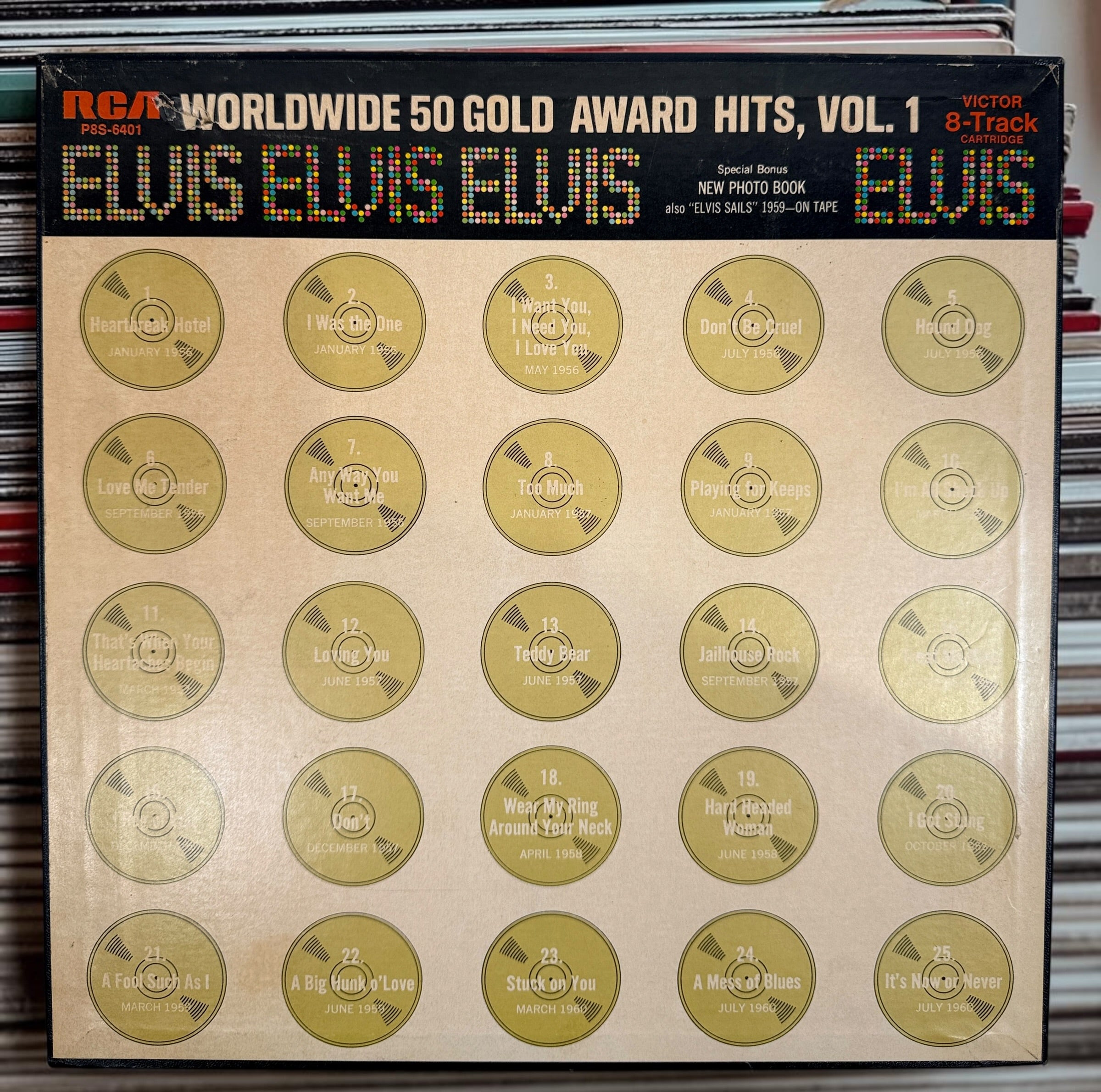 Complete vintage RCA Elvis Presley Worldwide 50 Gold Award Hits Vol. 1 box set with two original 8-track cartridges, photo album, and collector presentation box.