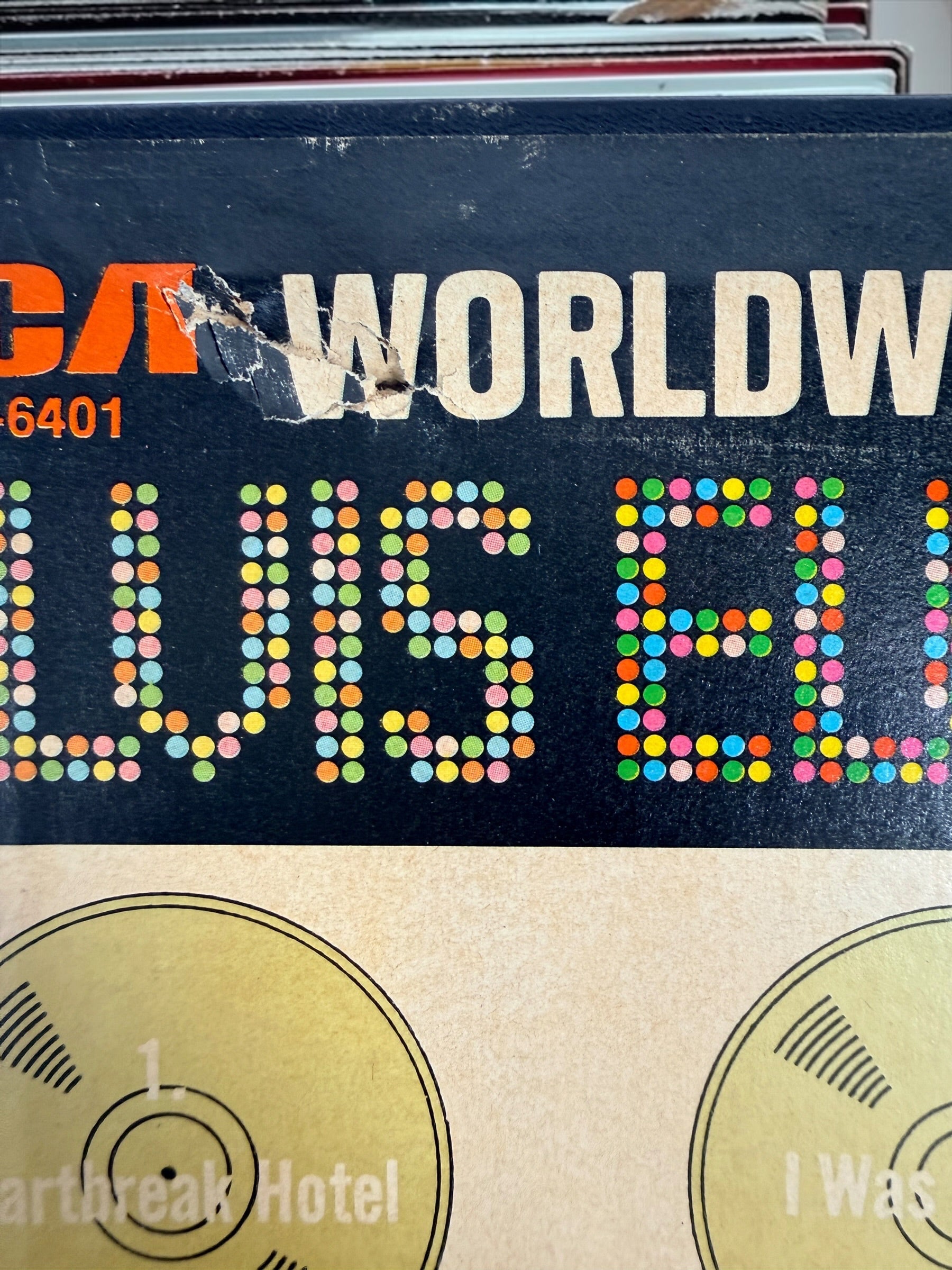 Complete vintage RCA Elvis Presley Worldwide 50 Gold Award Hits Vol. 1 box set with two original 8-track cartridges, photo album, and collector presentation box.