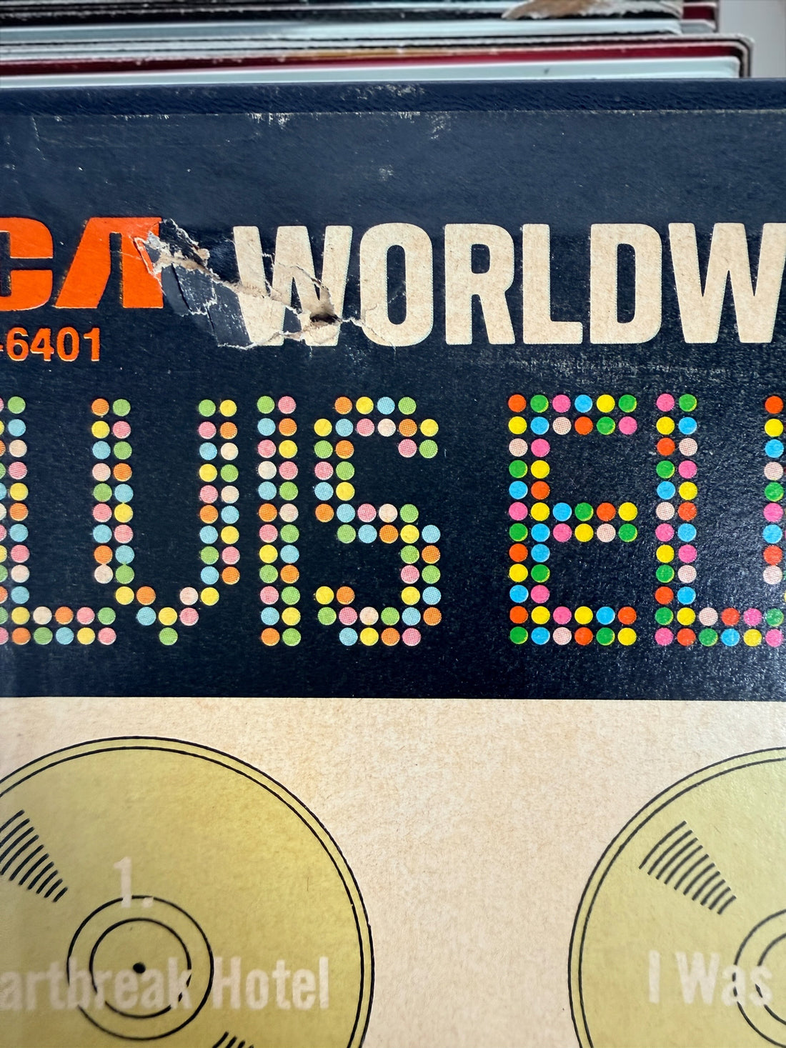Complete vintage RCA Elvis Presley Worldwide 50 Gold Award Hits Vol. 1 box set with two original 8-track cartridges, photo album, and collector presentation box.