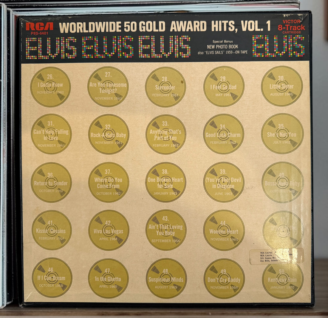 Complete vintage RCA Elvis Presley Worldwide 50 Gold Award Hits Vol. 1 box set with two original 8-track cartridges, photo album, and collector presentation box.