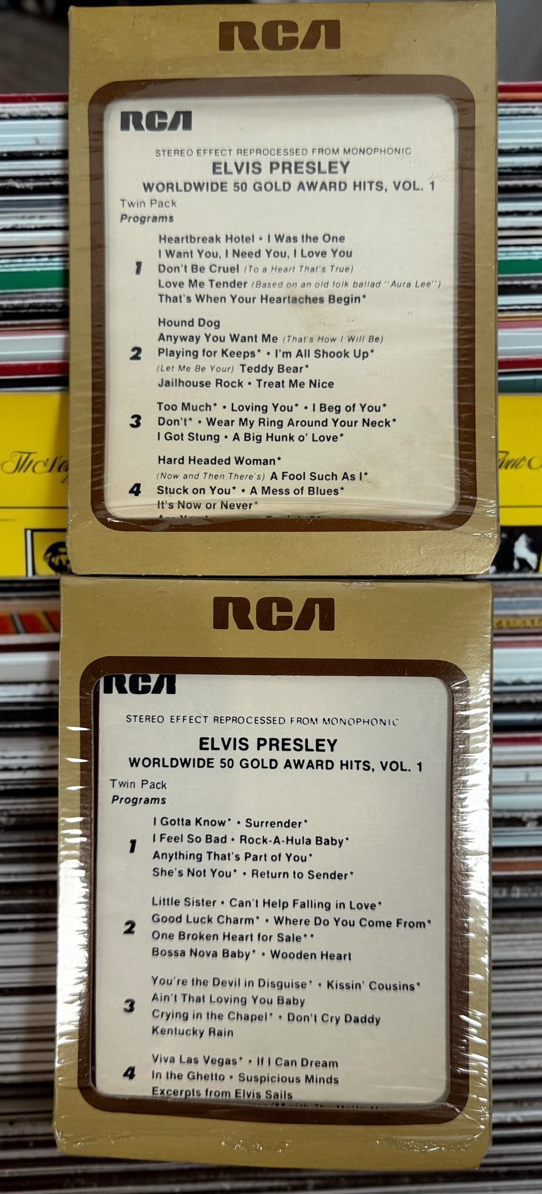 Complete vintage RCA Elvis Presley Worldwide 50 Gold Award Hits Vol. 1 box set with two original 8-track cartridges, photo album, and collector presentation box.