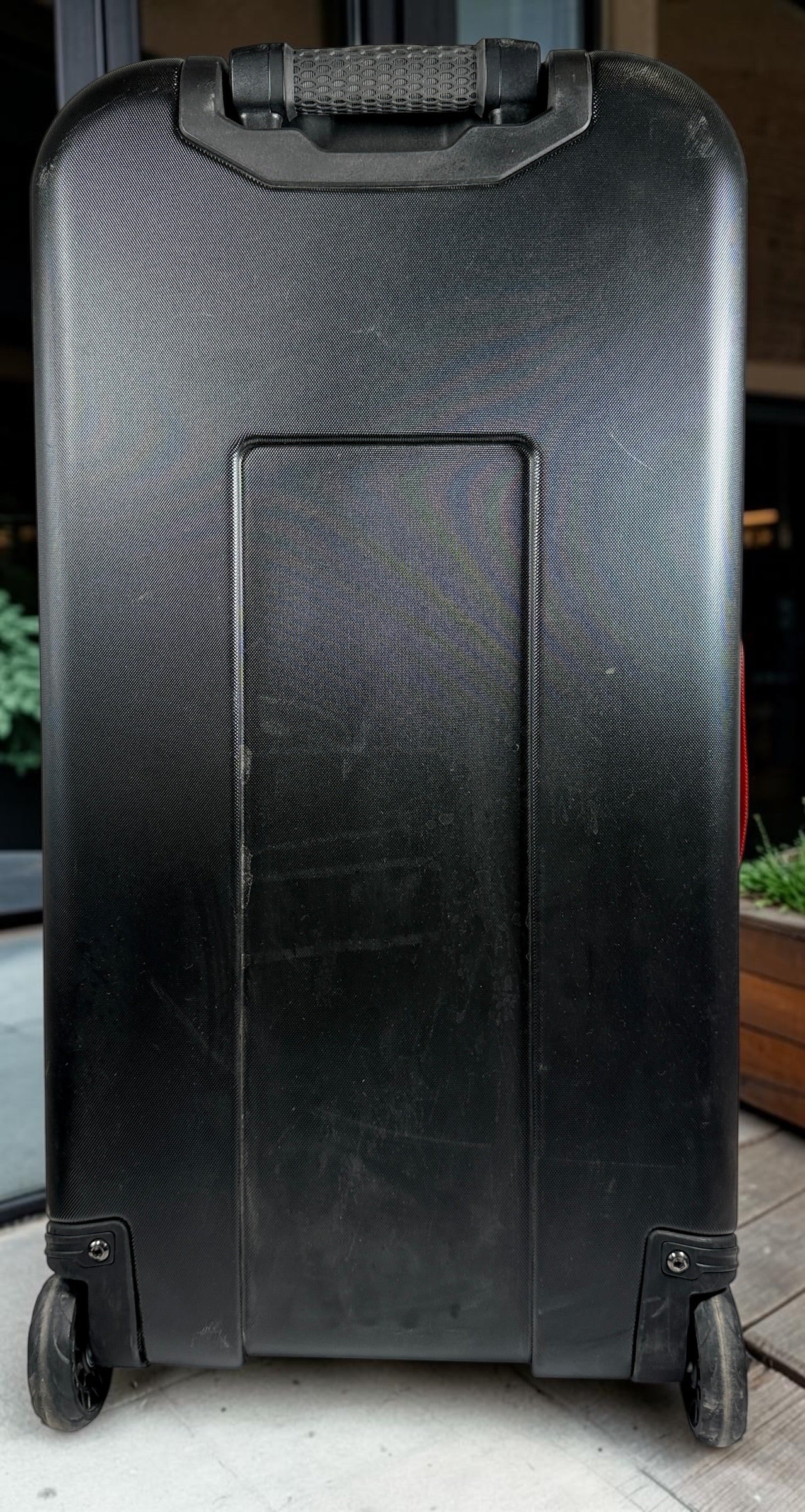Official Lululemon Team Canada rolling suitcase in vibrant Olympic red. Large wheeled travel luggage with spacious interior, compression straps, and rare Canadian Olympic branding