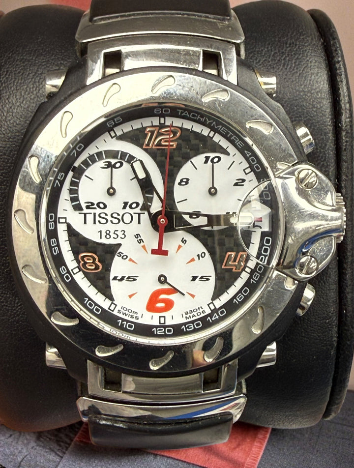Rare Tissot T-Race MotoGP 2007 Limited Edition chronograph No. 1700/7002 with original helmet case, manuals, warranty card, and circuit medallions. Complete collector set.