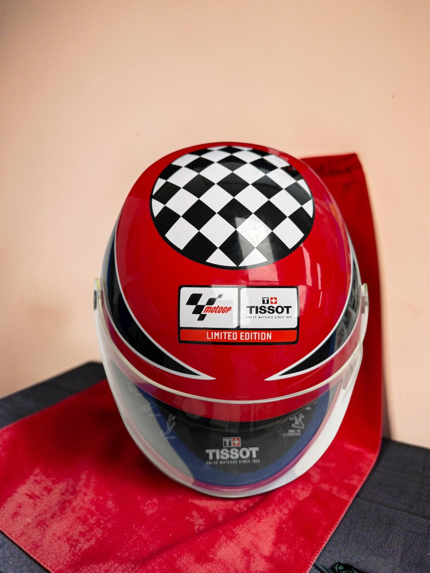 Rare Tissot T-Race MotoGP 2007 Limited Edition chronograph No. 1700/7002 with original helmet case, manuals, warranty card, and circuit medallions. Complete collector set.