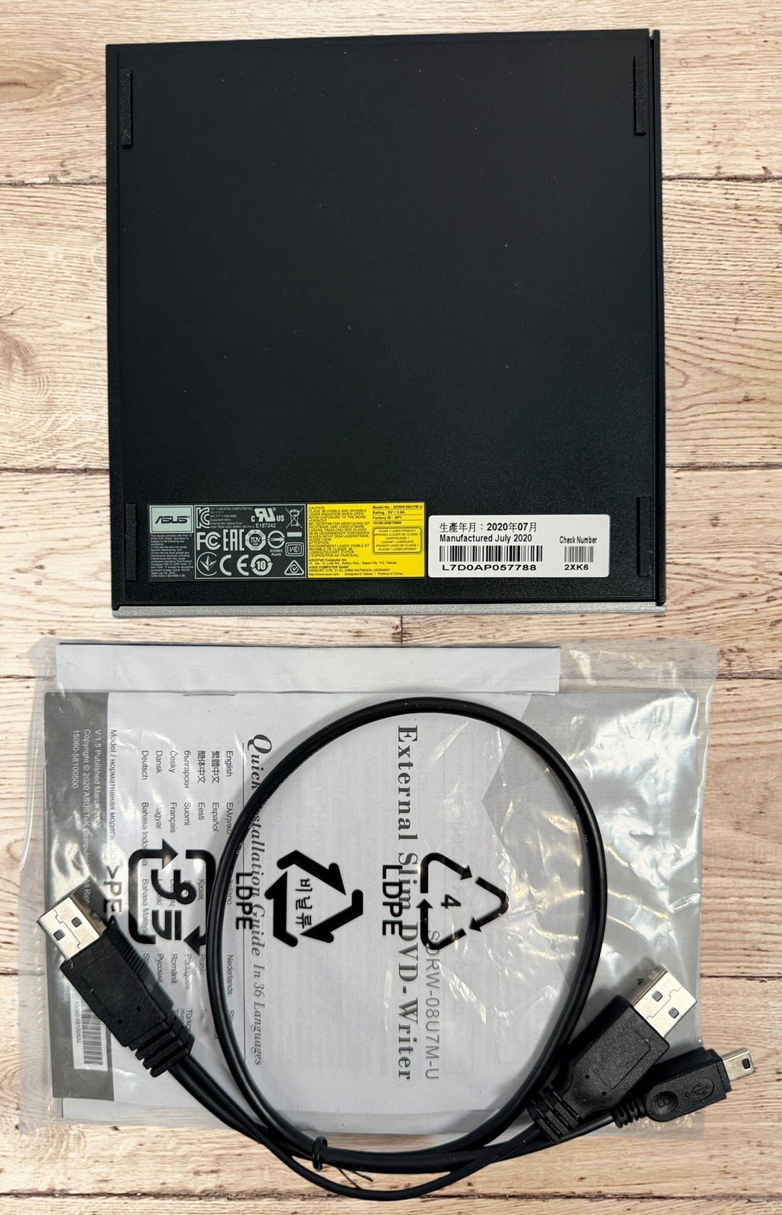 ASUS ZenDrive SDRW-08U7M-U external USB DVD writer with original box, USB cable and manuals. Ultra-slim, M-DISC compatible, tested and fully functional for Windows and Mac.