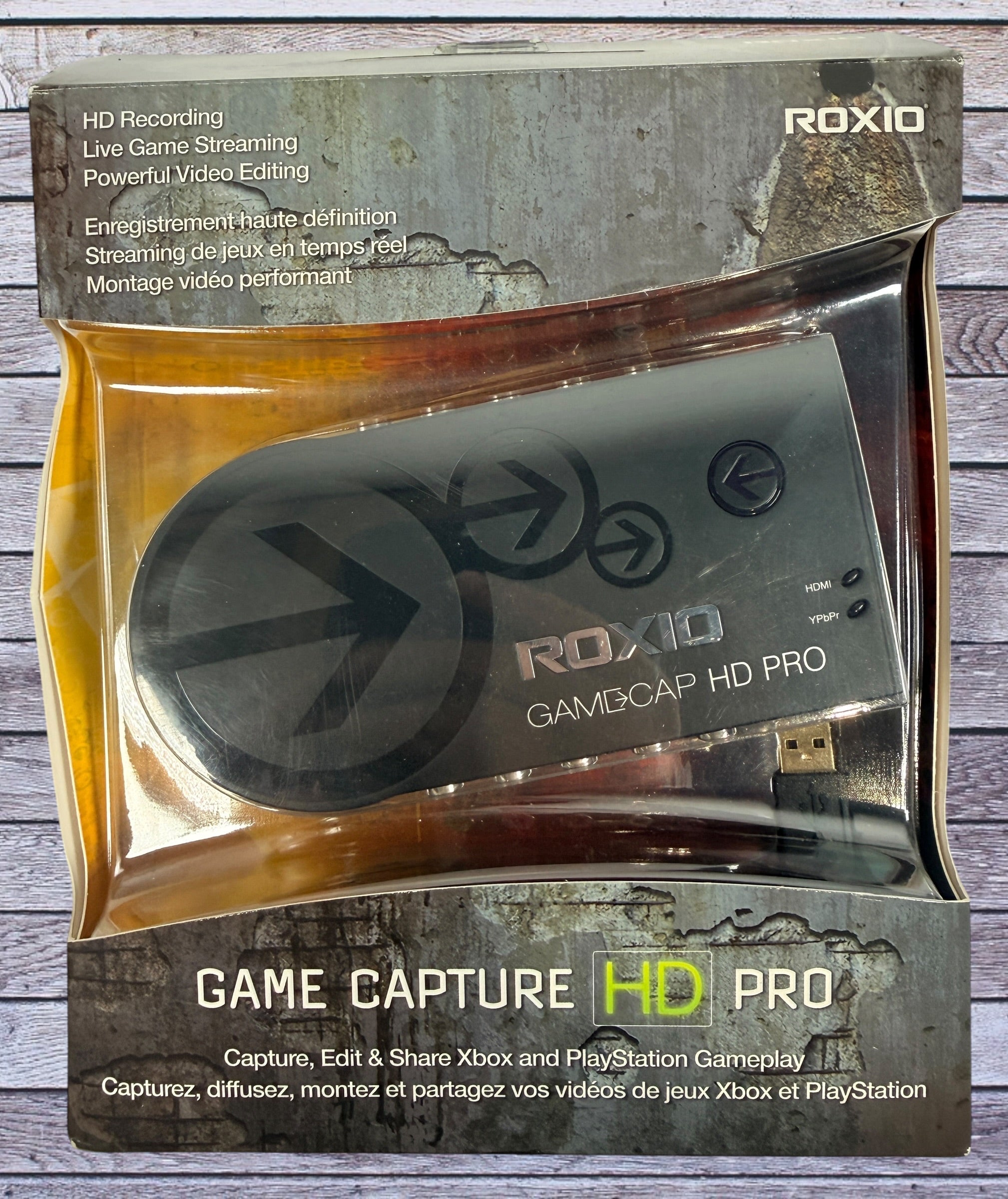 Capture Xbox and PlayStation gameplay with the Roxio Game Capture HD Pro. Includes original box, USB cable, HDMI support, and HD recording capability.