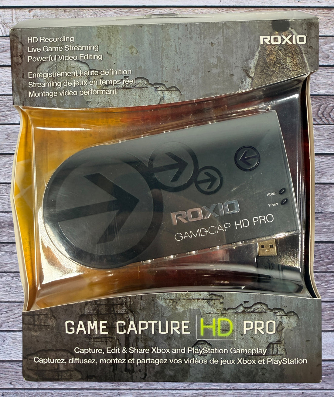 Capture Xbox and PlayStation gameplay with the Roxio Game Capture HD Pro. Includes original box, USB cable, HDMI support, and HD recording capability.